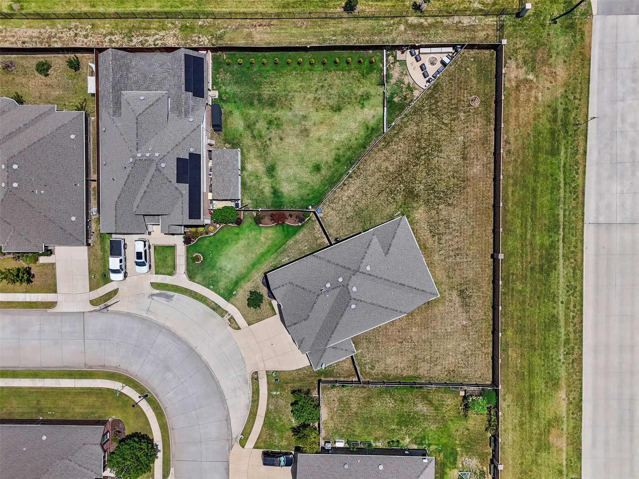 Aerial perspective highlighting a cul-de-sac property with an expansive lot