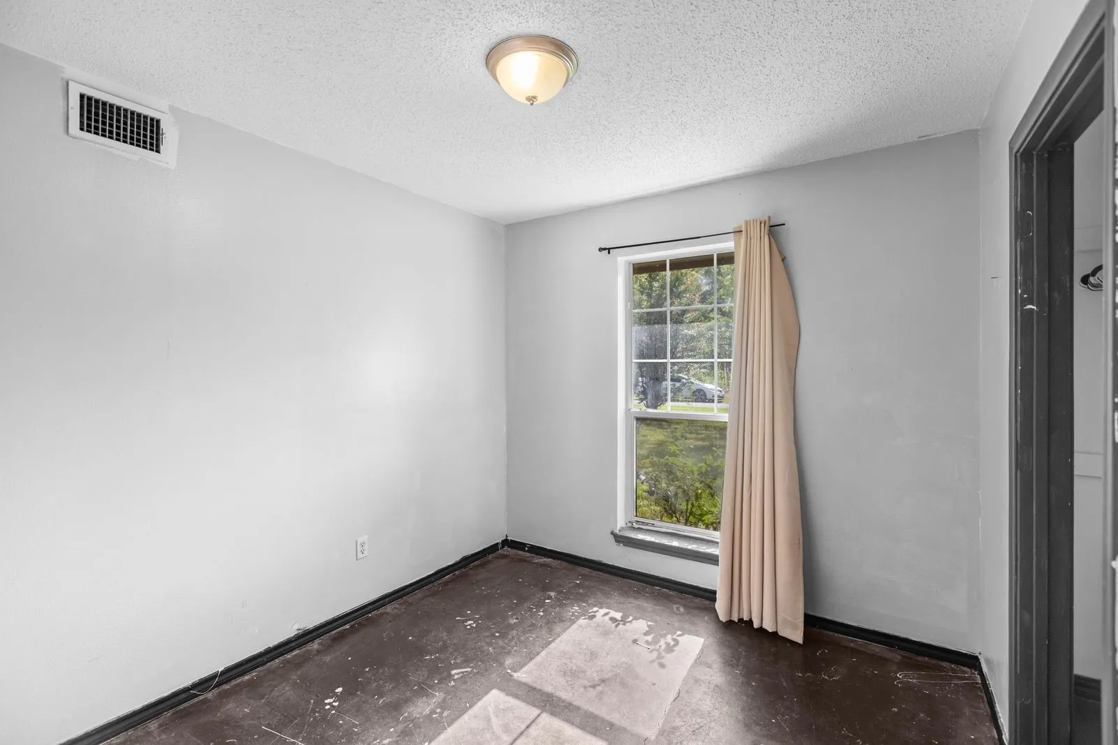 Bedroom with concrete floors