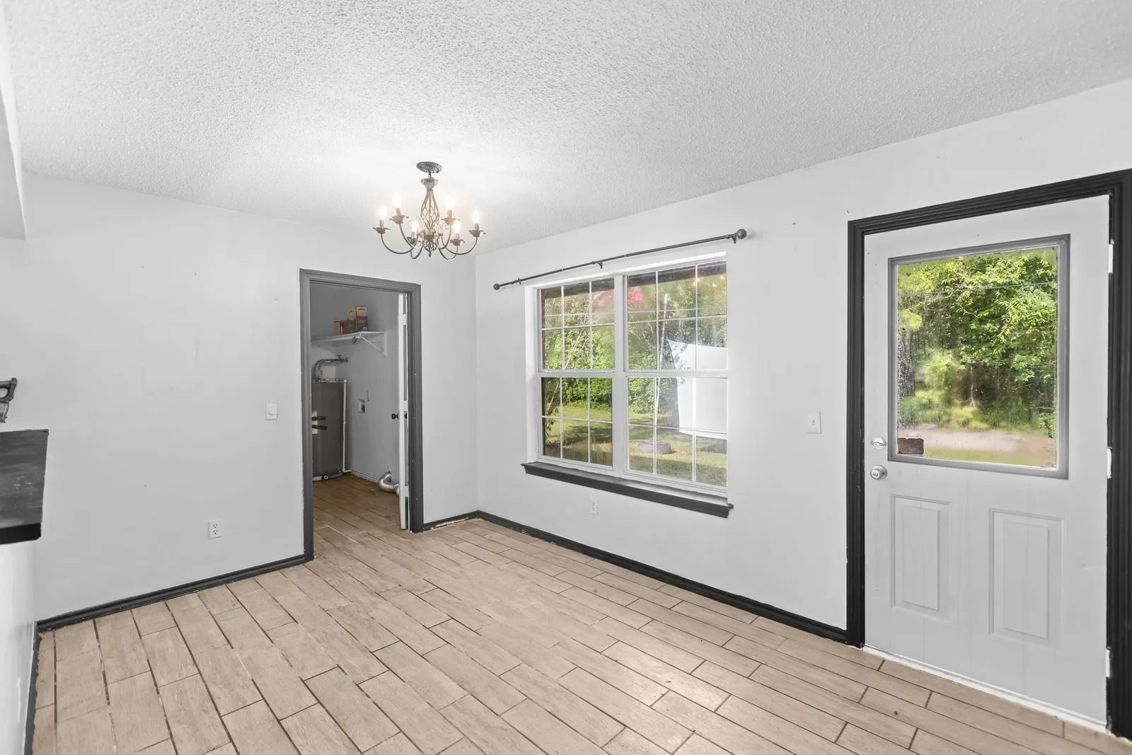 Dining room leading to utility, garage, living, back yard