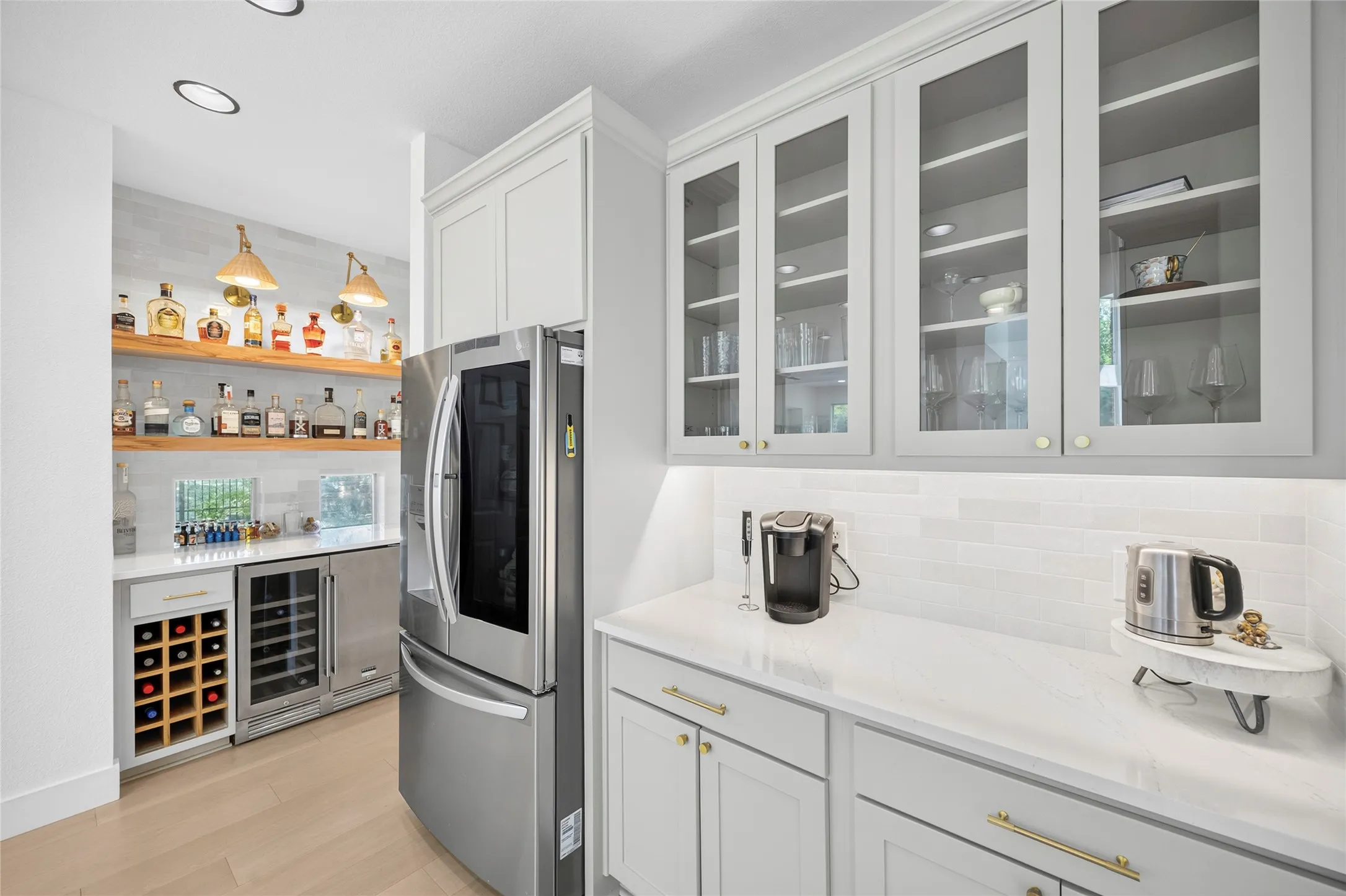 Walls of cabinets all fresh brush gold fixtures