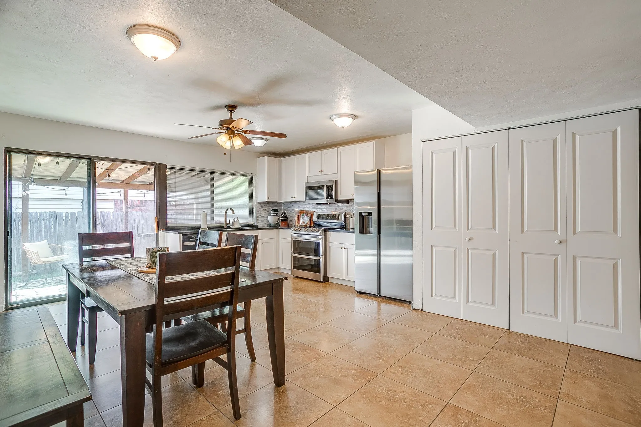 Large updated kitchen with eat in space and utility closet.