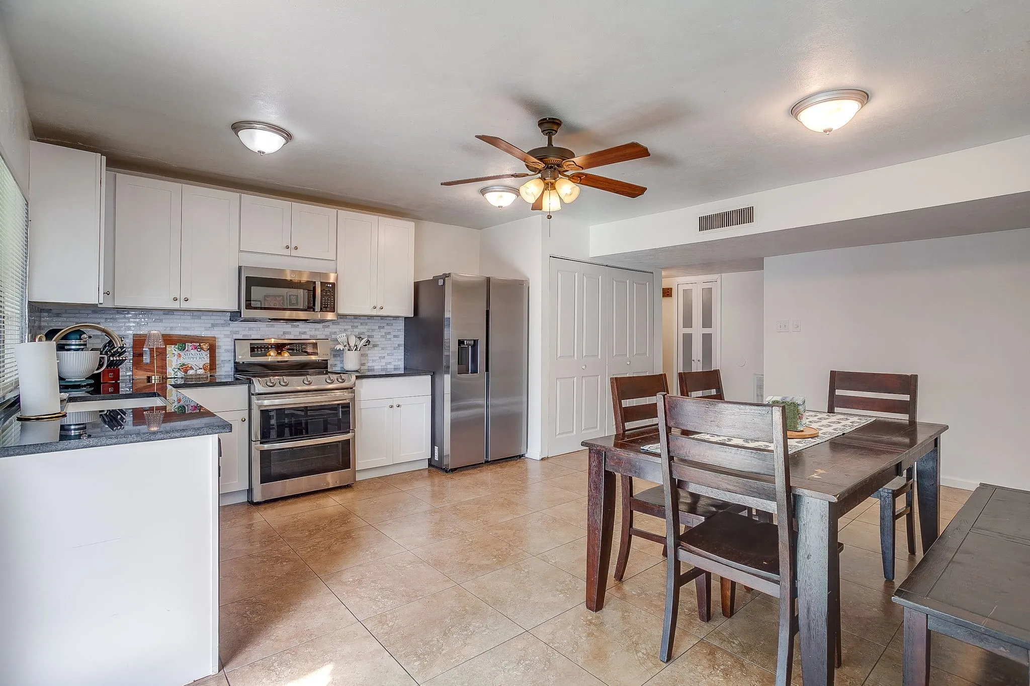 Light and bright kitchen open to the large eat in space great for gatherings.