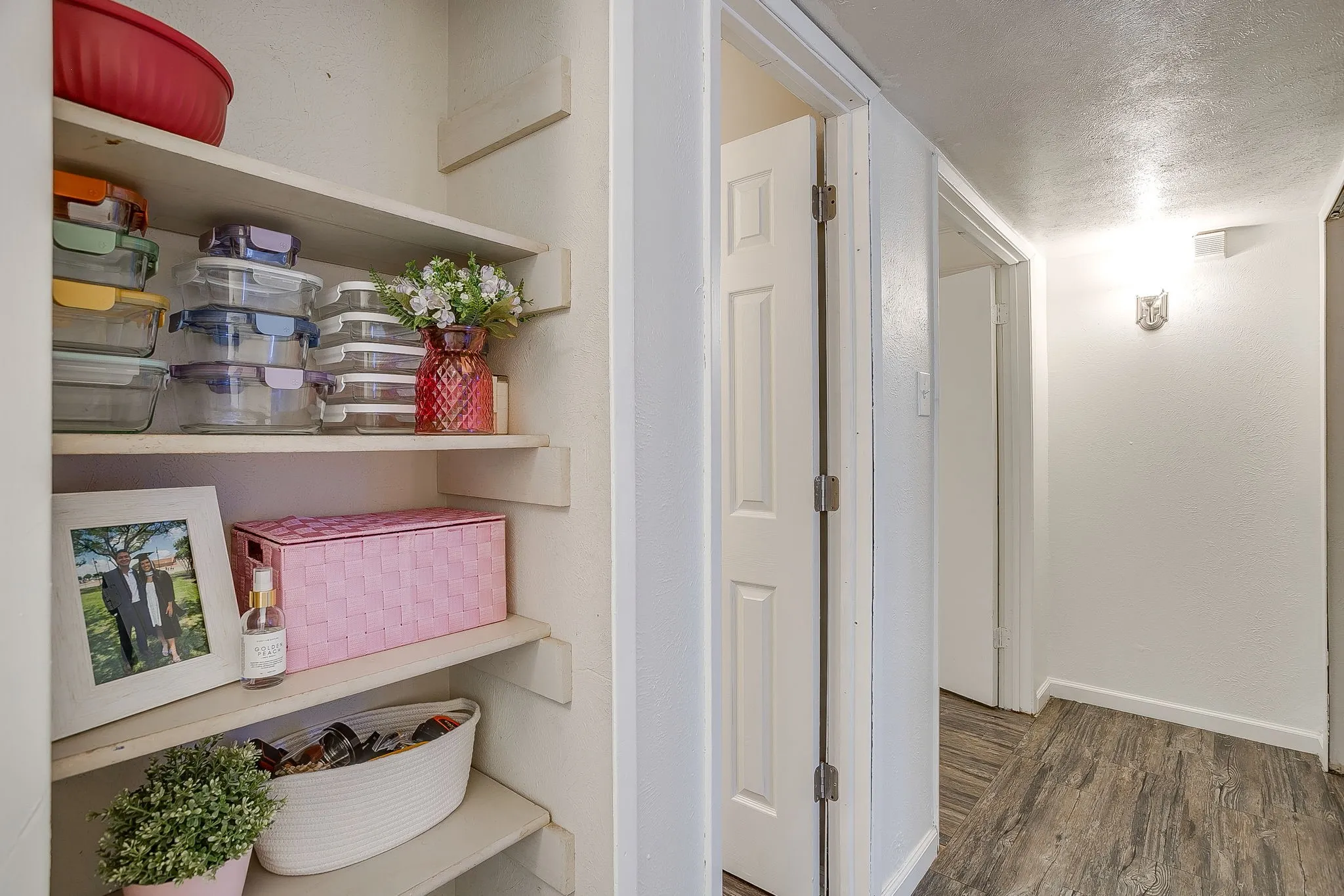 Love the use of these open closets for decoration or additional storage.