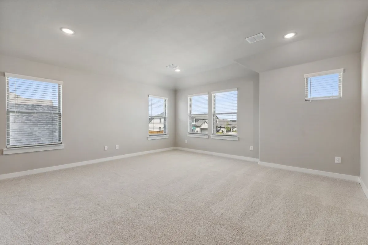 Game room in the Masters home plan by Trophy Signature Homes – REPRESENTATIVE PHOTO