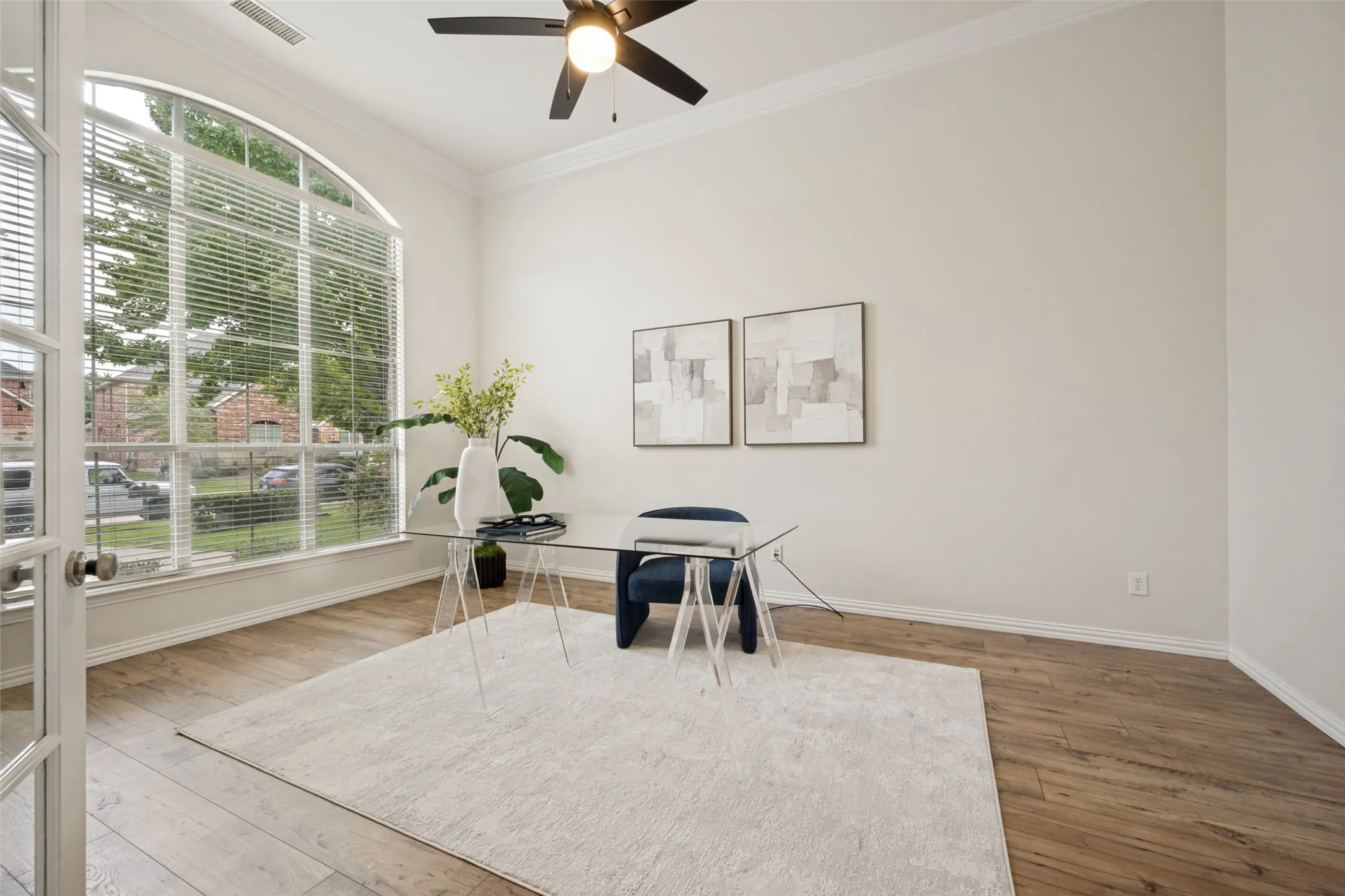 Large office with arched windows and glass doors
