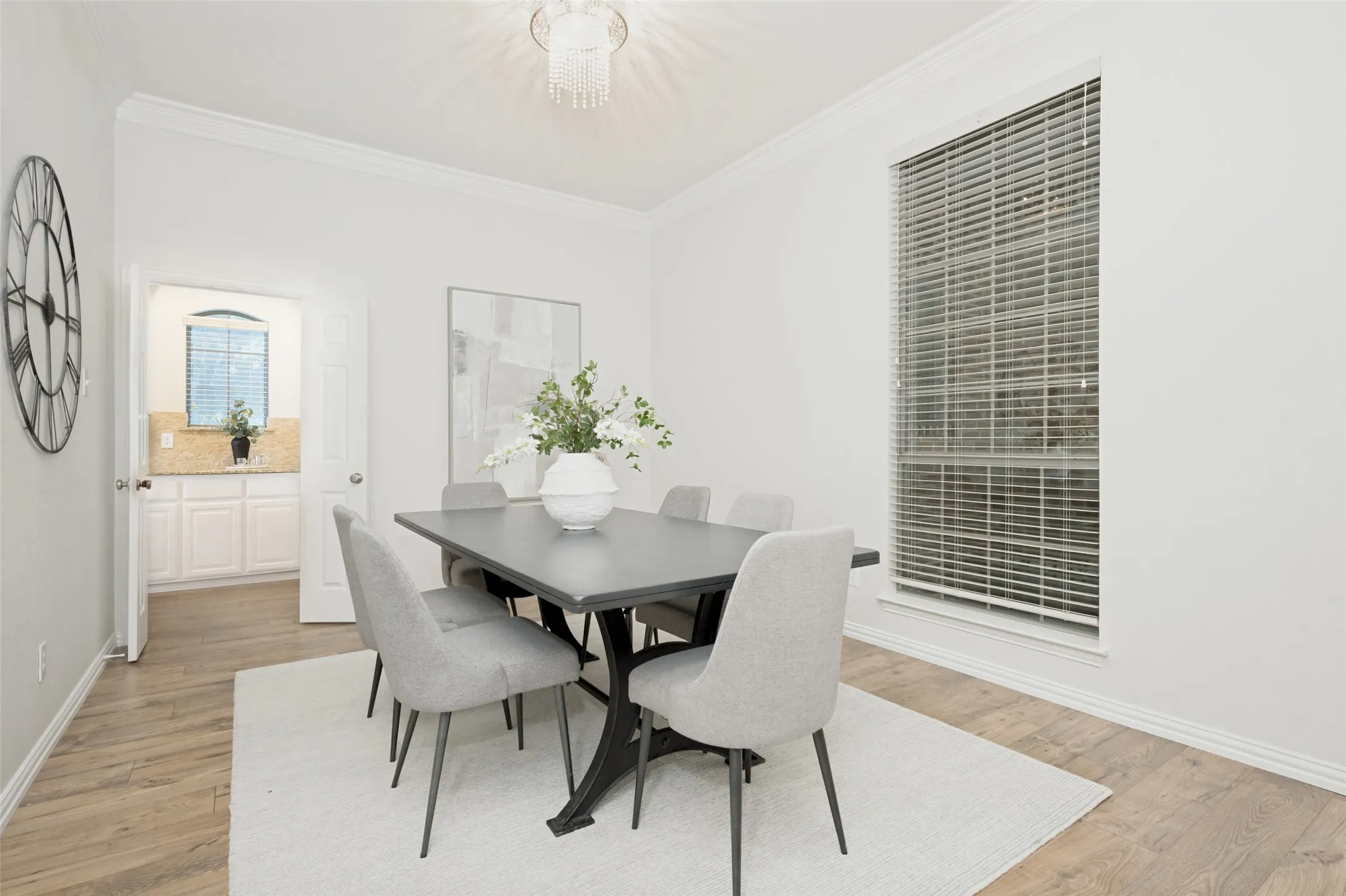 Formal dining area opening to the kitchen through French doors