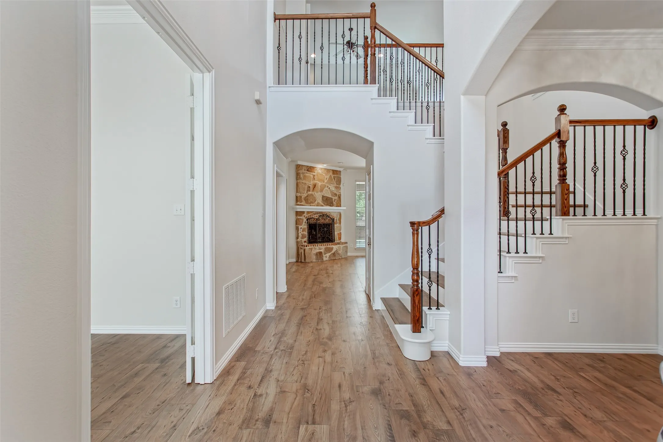 Spacious entryway featuring beautiful arched walk ways