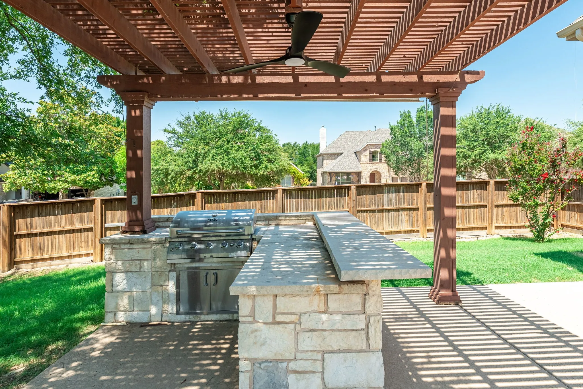 Outdoor kitchen gazebo with fan, grill and beverage cooler