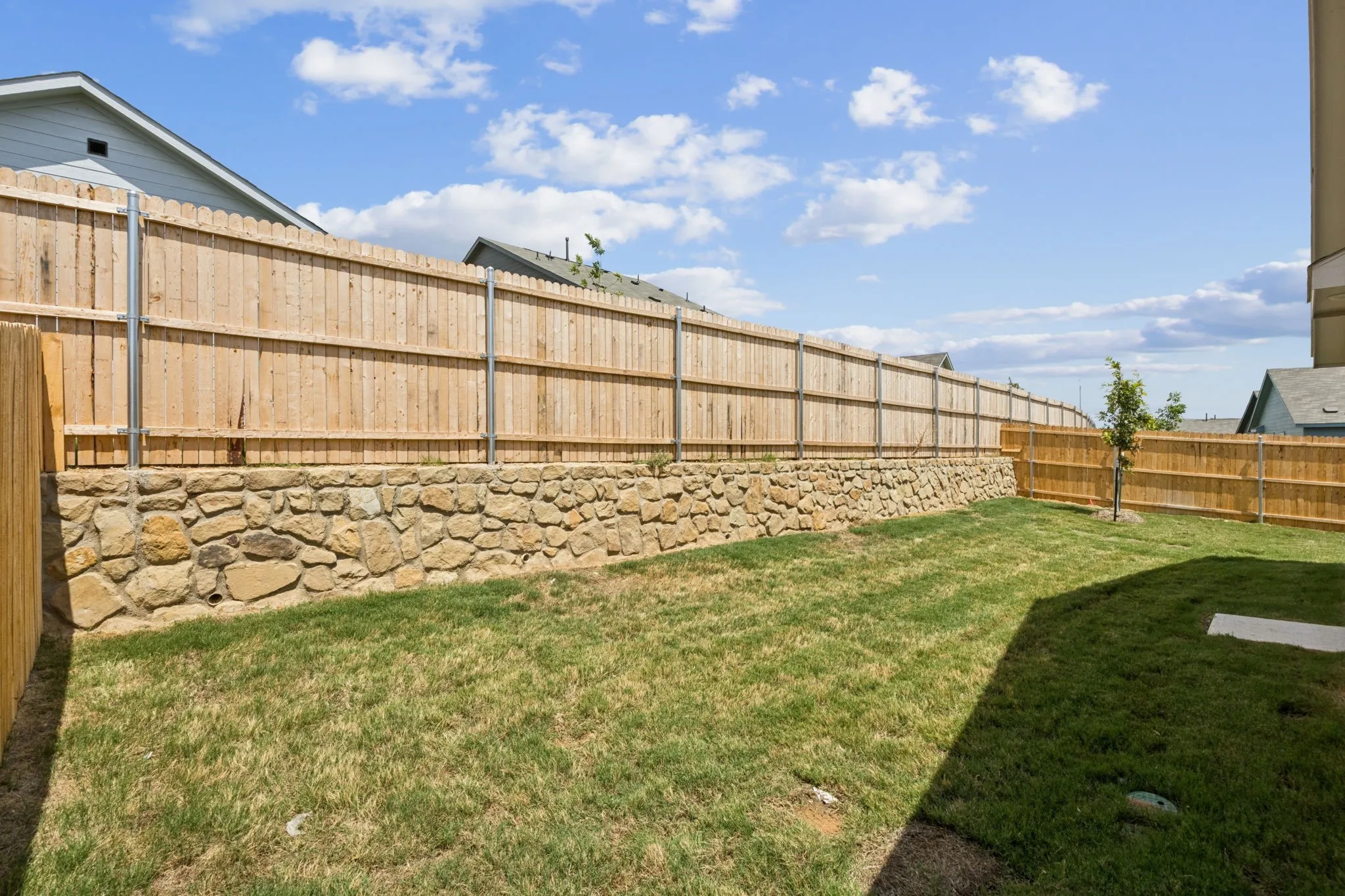View of large fenced backyard