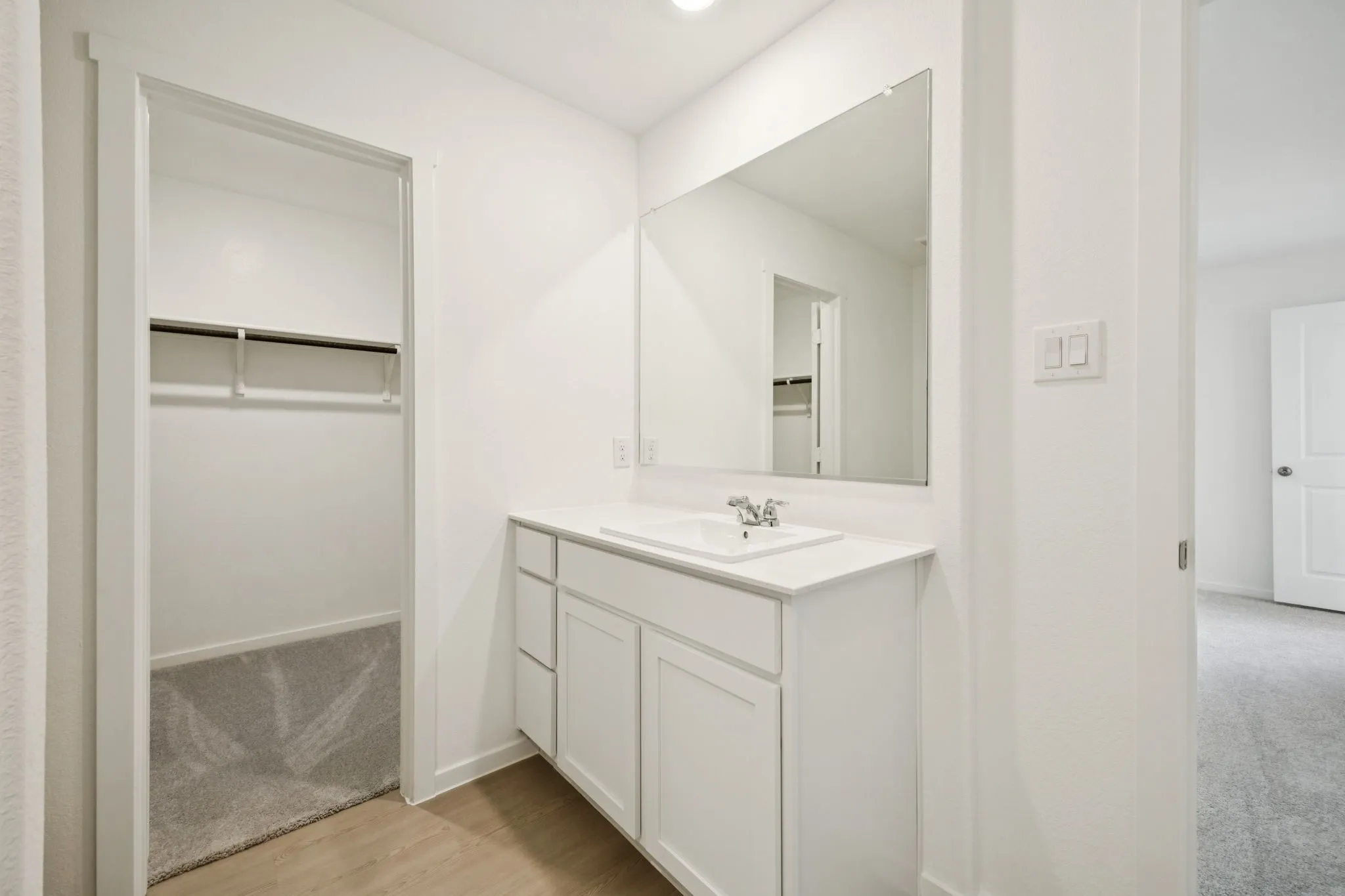 Bathroom with a walk in closet