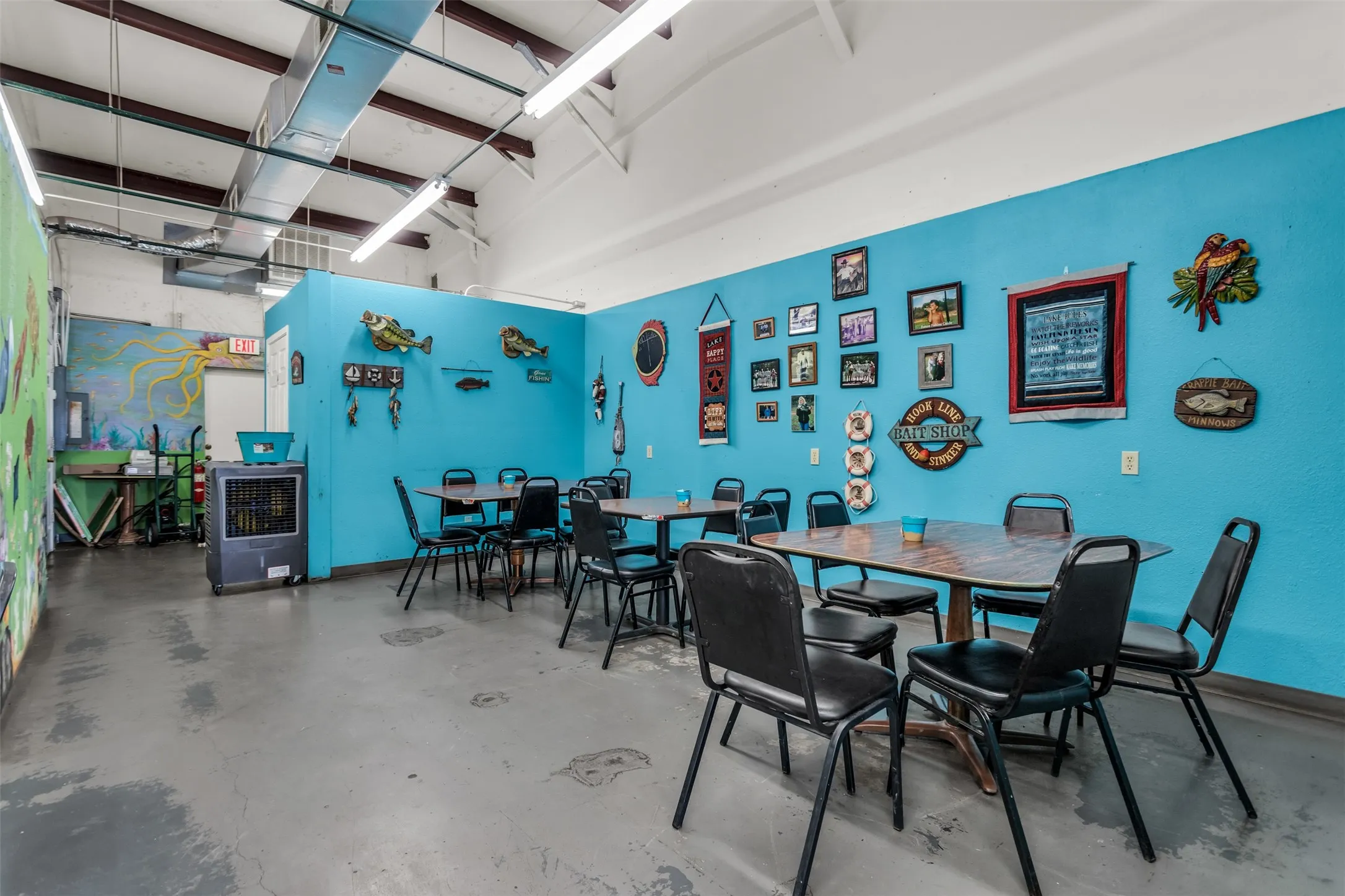 Spacious interior with high ceilings and exposed ductwork