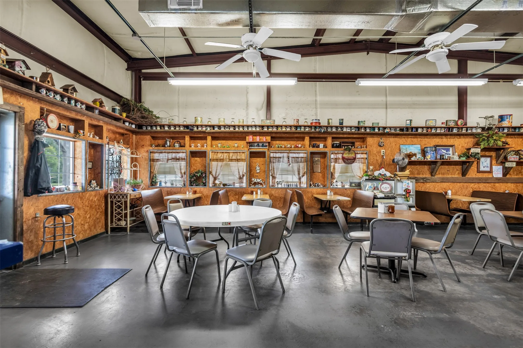 Spacious interior featuring high ceilings and exposed structural beams