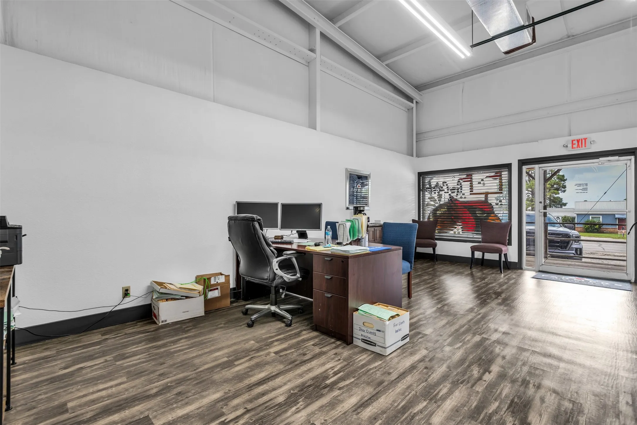 Commercial interior featuring laminate flooring and white walls
