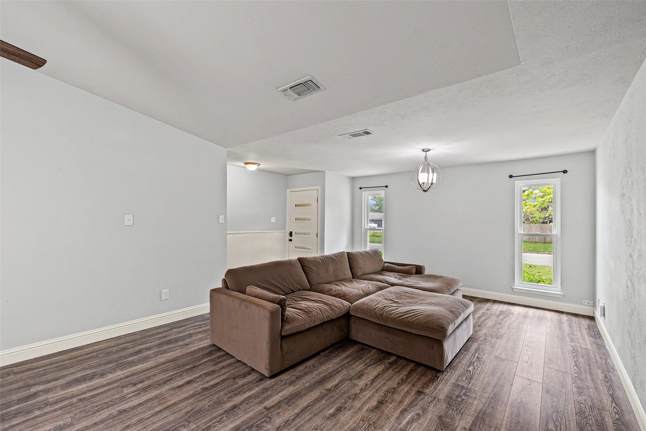 Right off the front door, you're welcomed by a large living area ready for a cozy movie night!