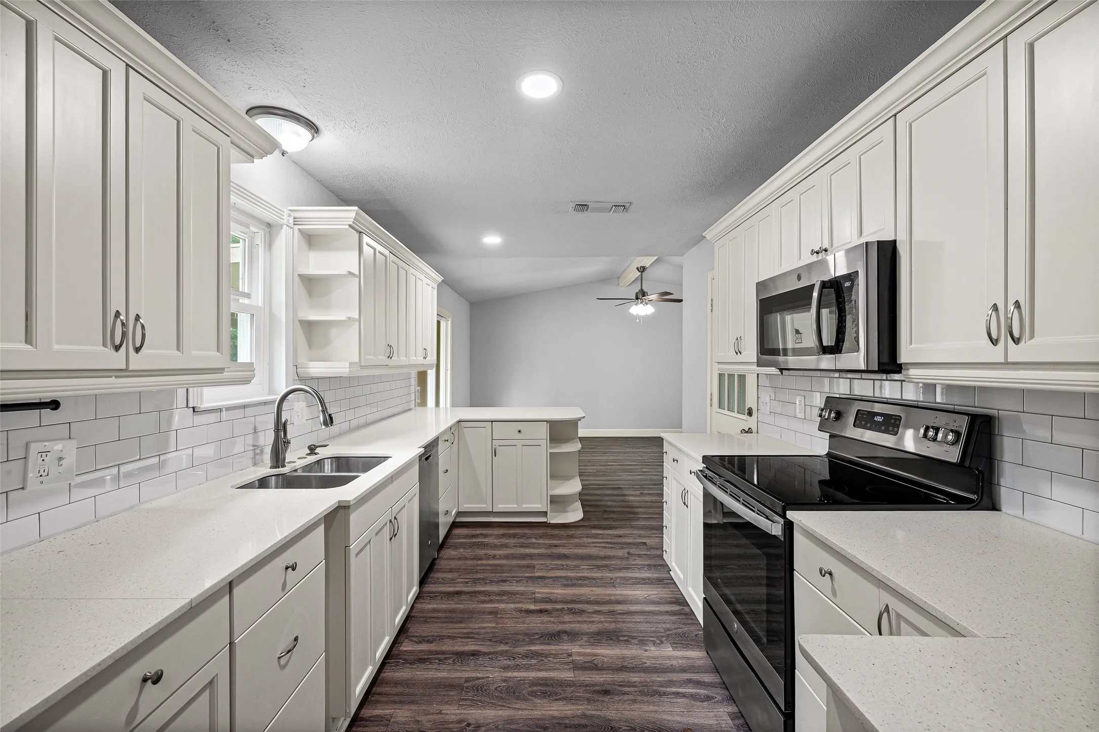 So much storage behind these beautiful white cabinets.