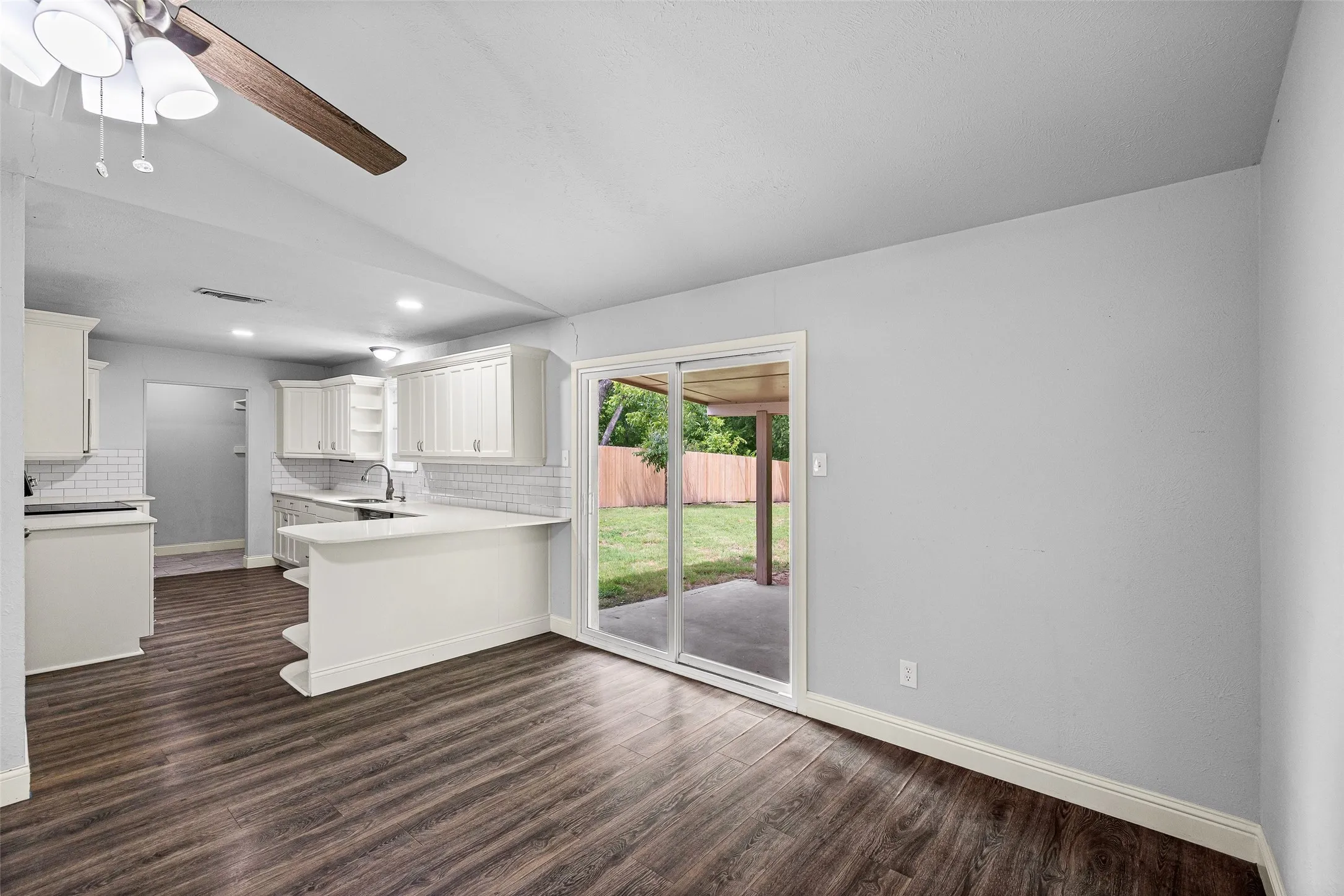 Dining area directly off the kitchen, perfect for a table for gathering.