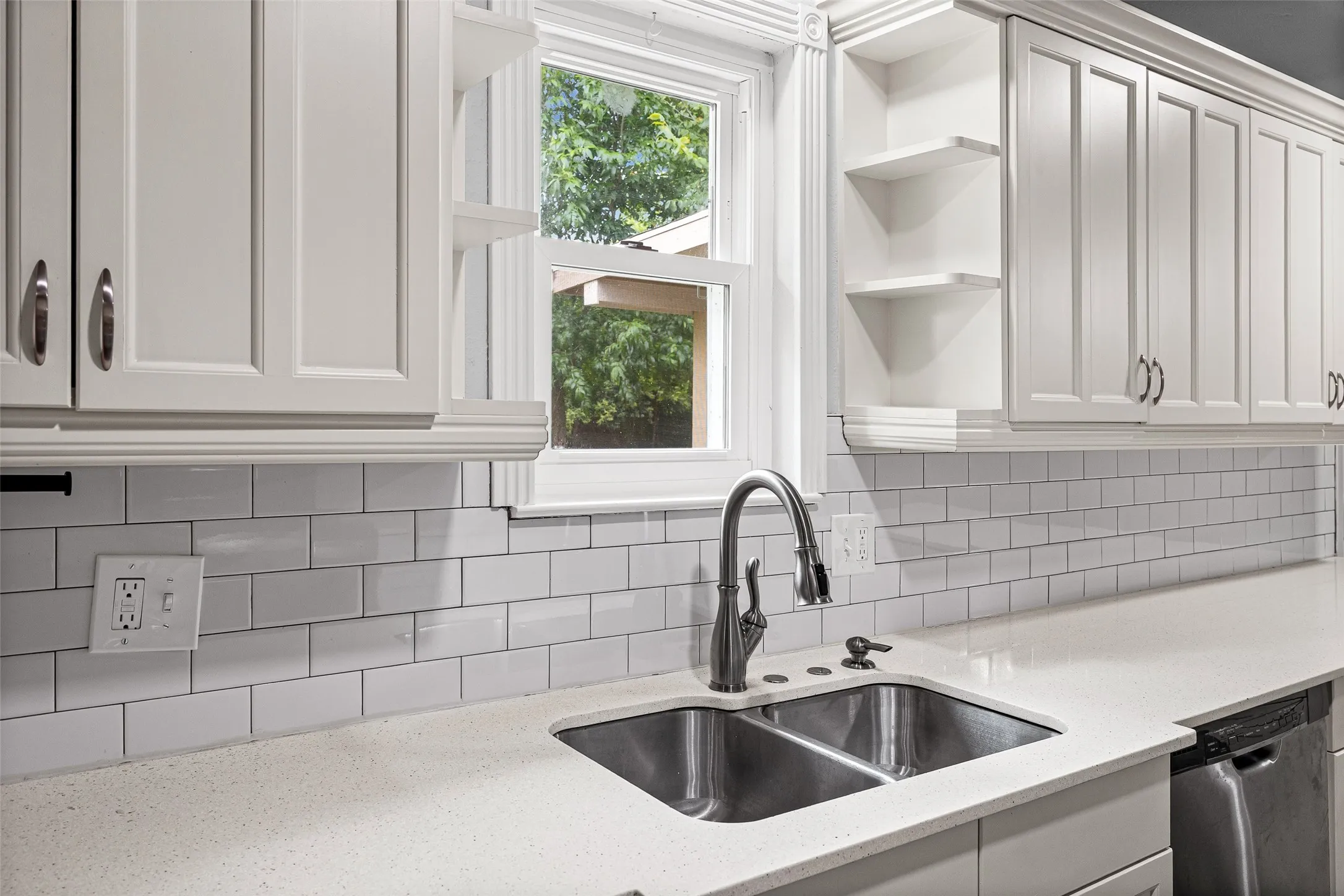 Beautifully updated kitchen with timeless subway tiles.