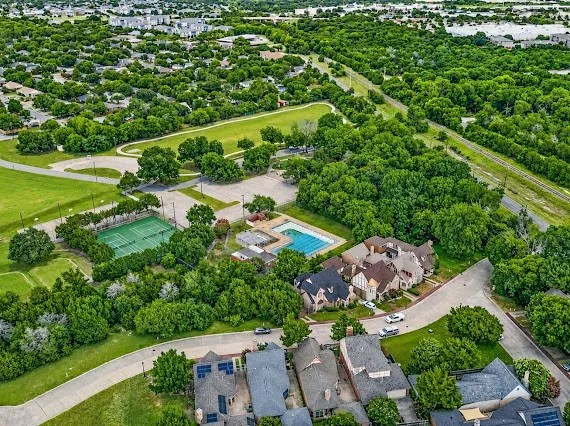 Aerial perspective showcasing a residential community with abundant green spaces