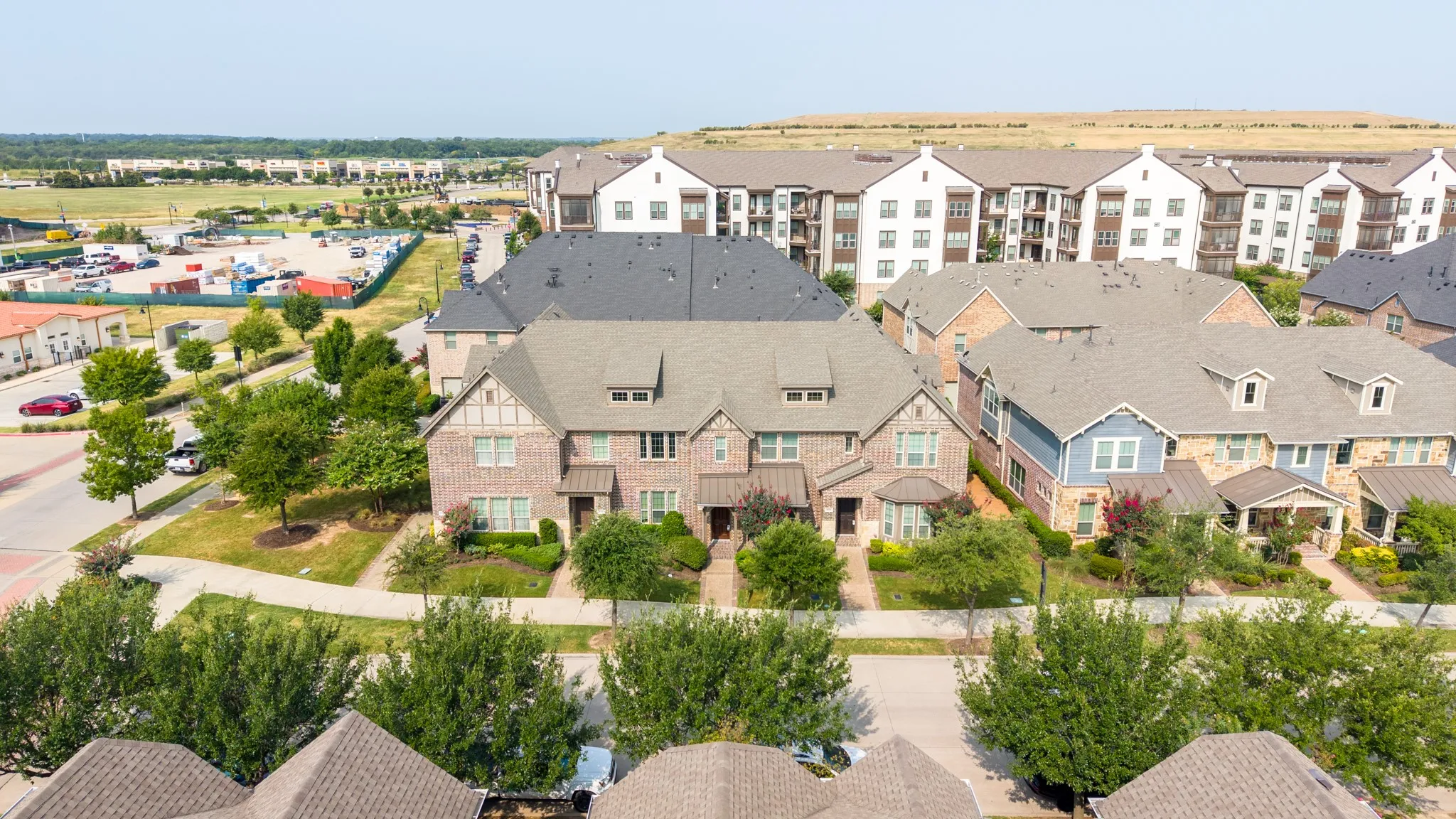 Brick and siding exteriors featuring gabled roofs and dormer windows