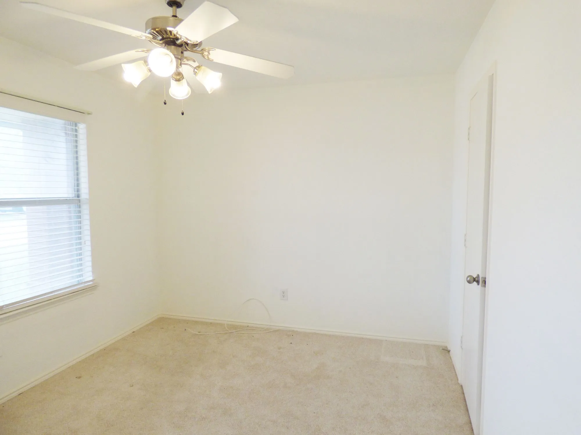 Neutral-toned carpeting and light wall paint