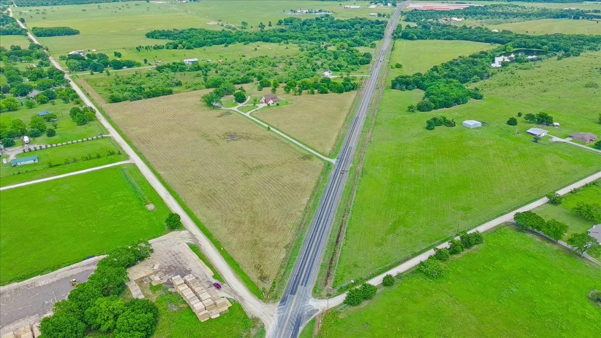 Property view from intersection of highway and county road.