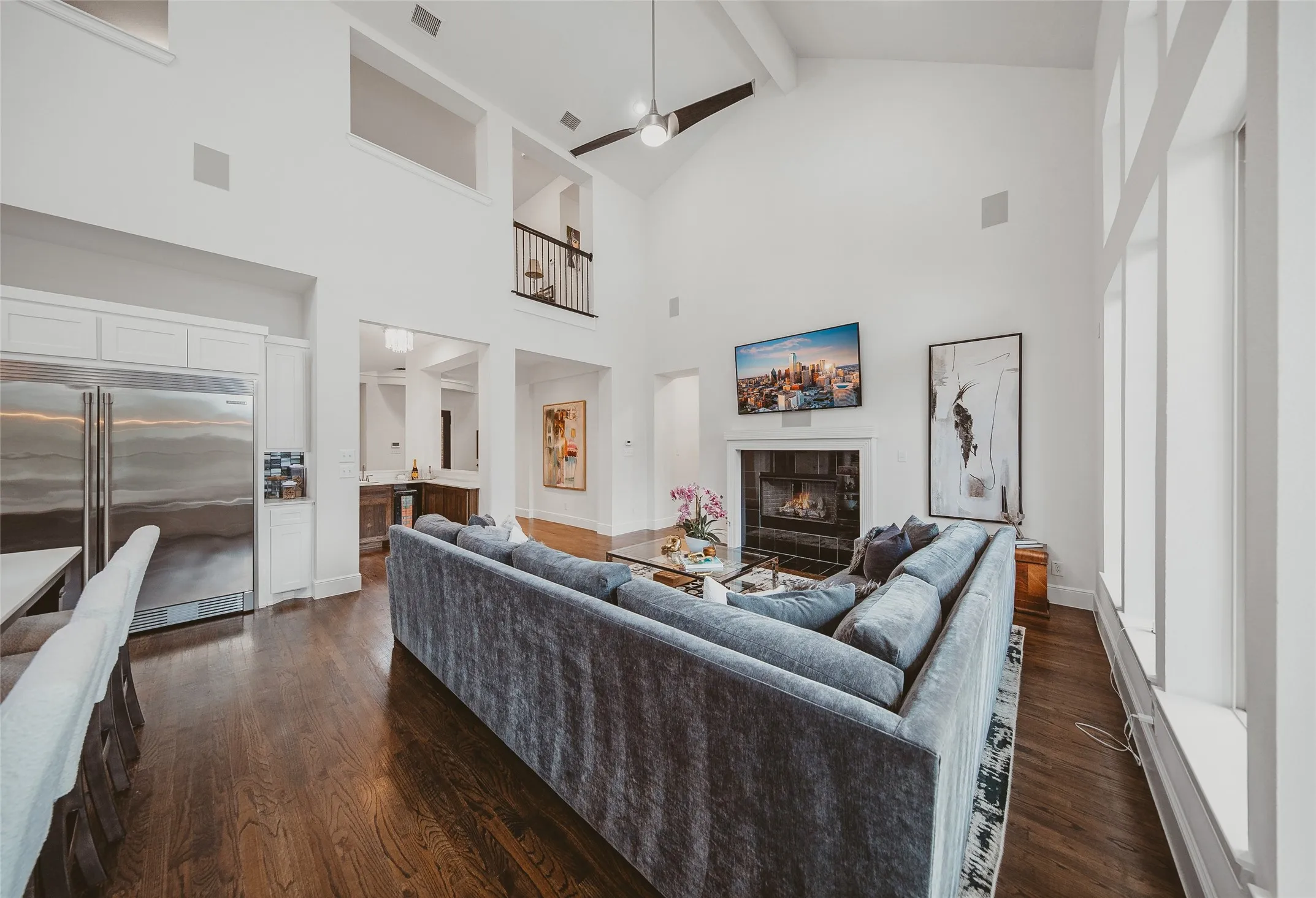 Great room with vaulted ceilings and wood-finish flooring