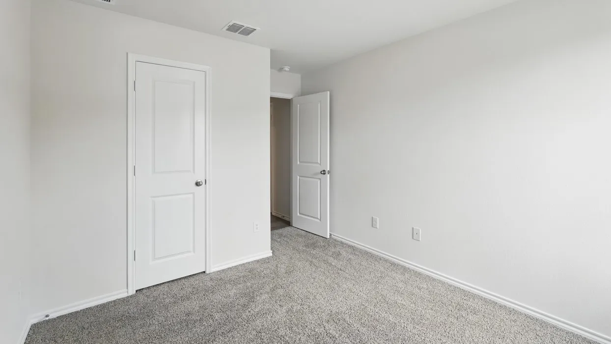 Room featuring grey carpet flooring and white walls
