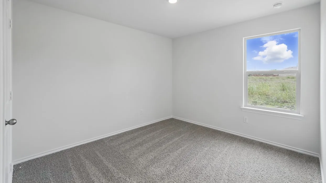 Room featuring light gray carpet, white walls, and a recessed ceiling light