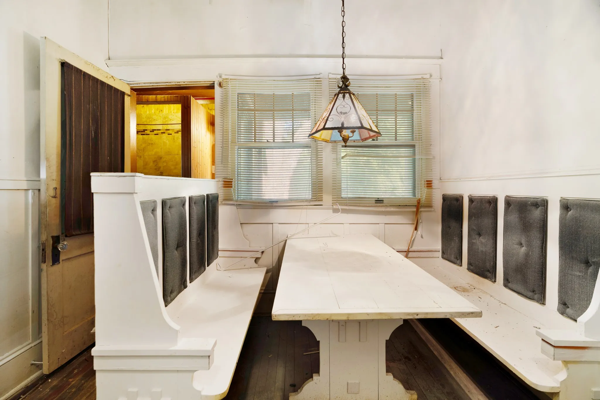 Built-in banquette seating with upholstered backrests