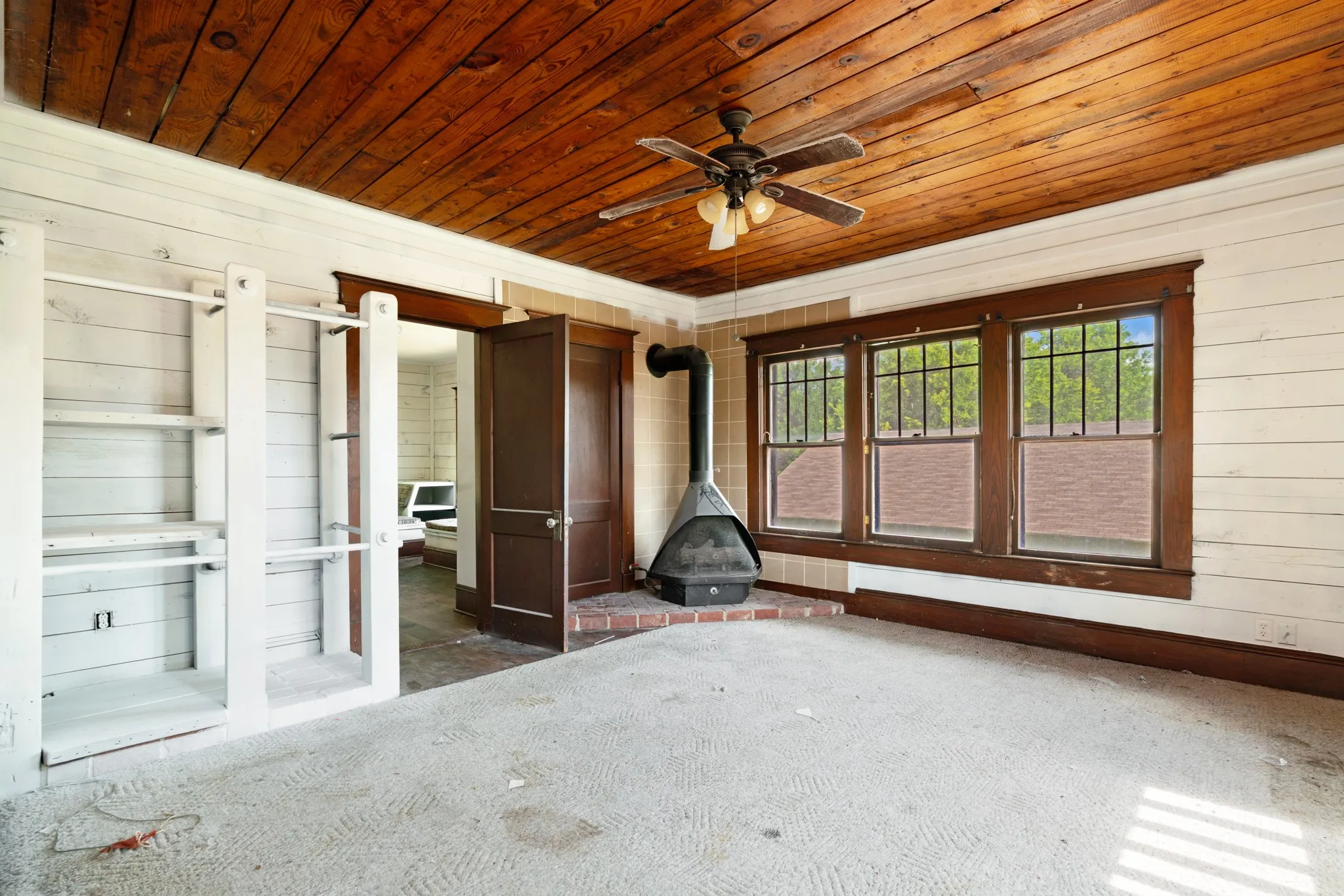 Bedroom with fireplace and shelving