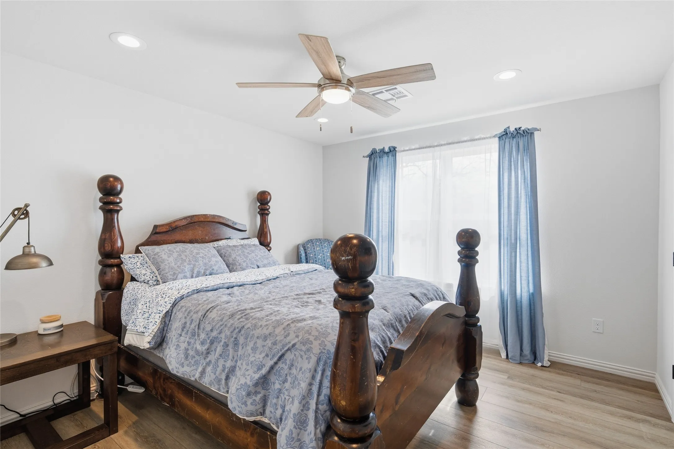 Bedroom featuring recessed lighting, a ceiling fan with light fixture, and wood-finish flooring