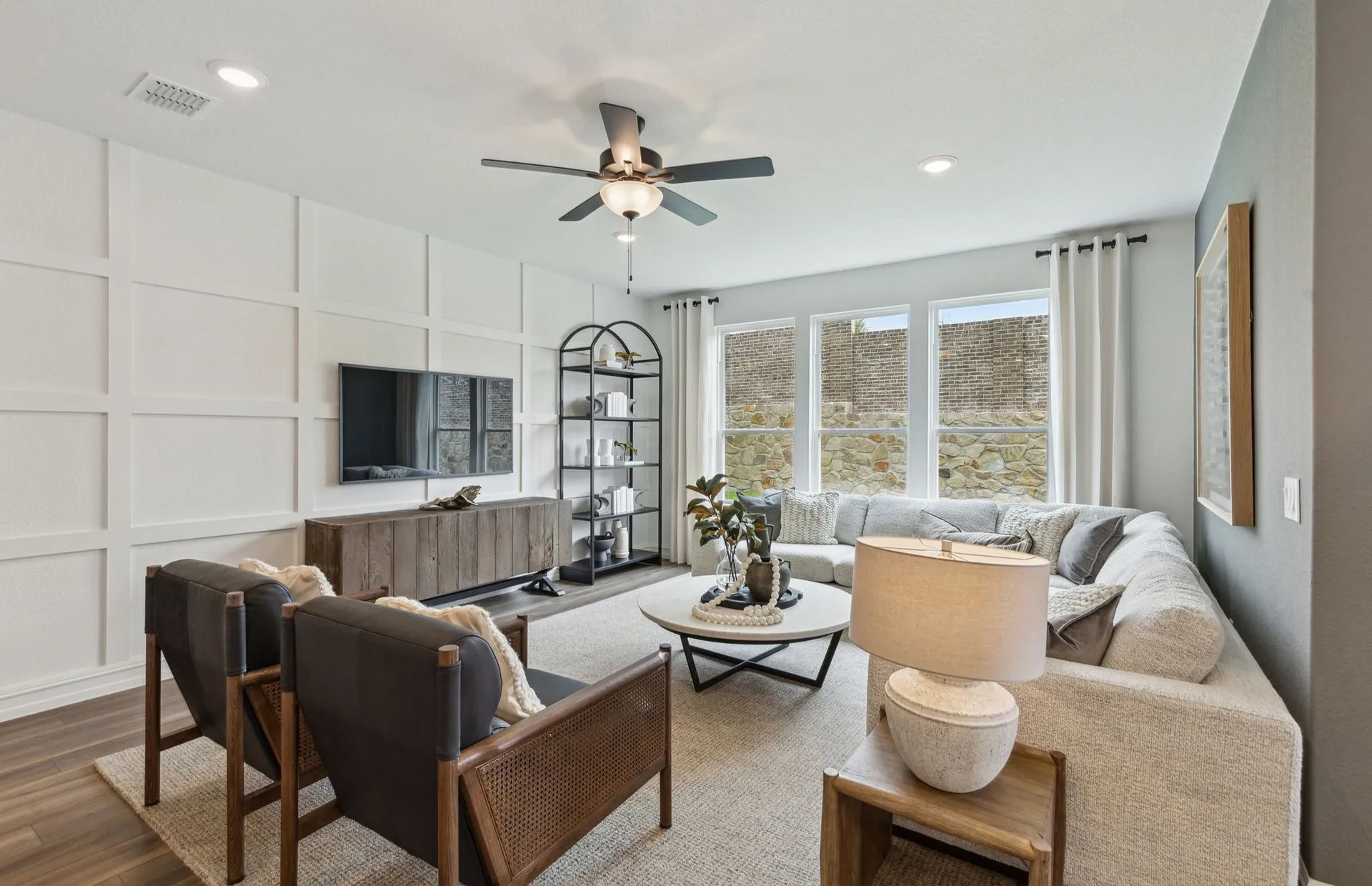 *Model Representation - Spacious gathering room with large windows