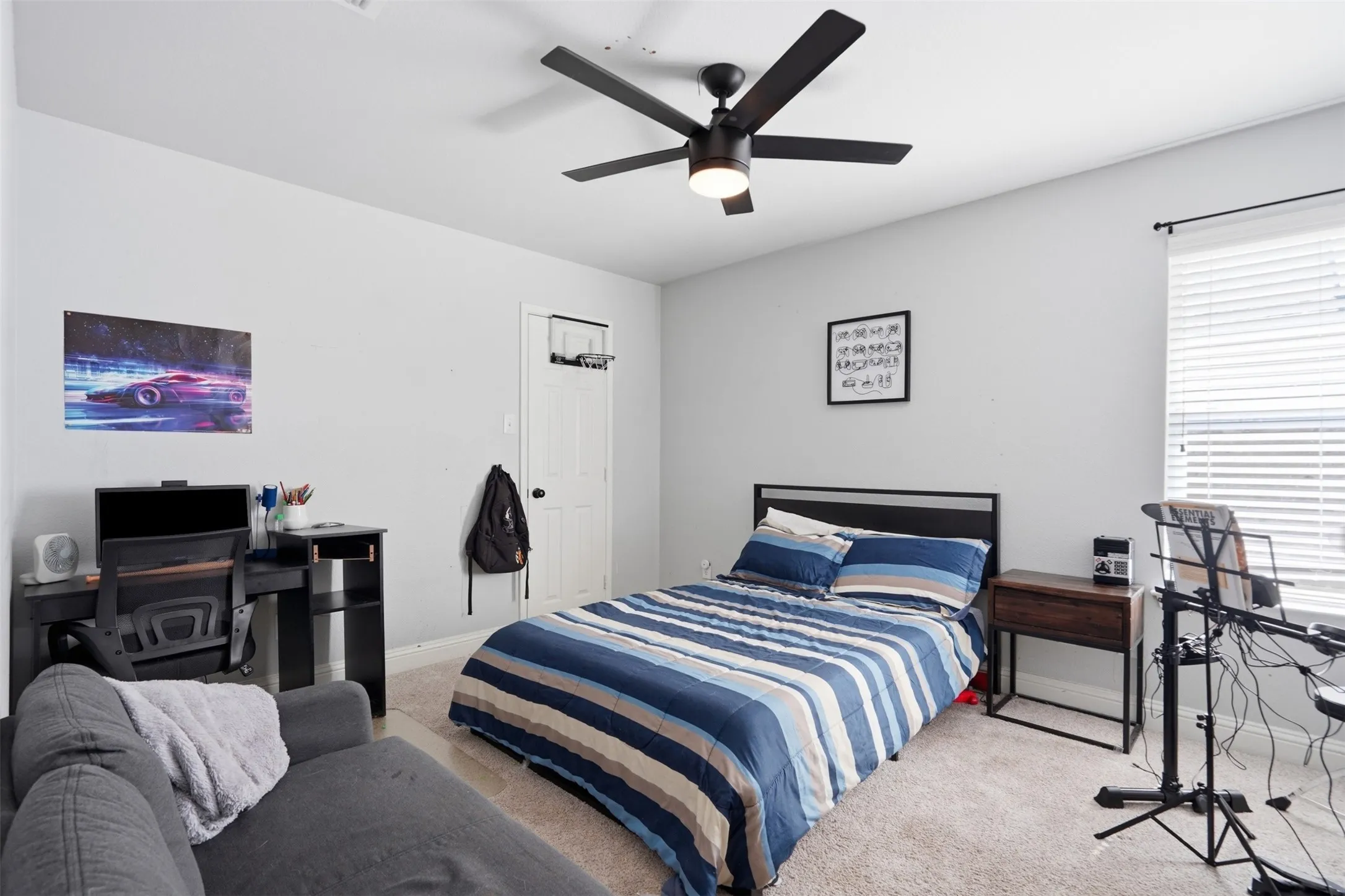Interior room featuring light gray walls and carpet flooring