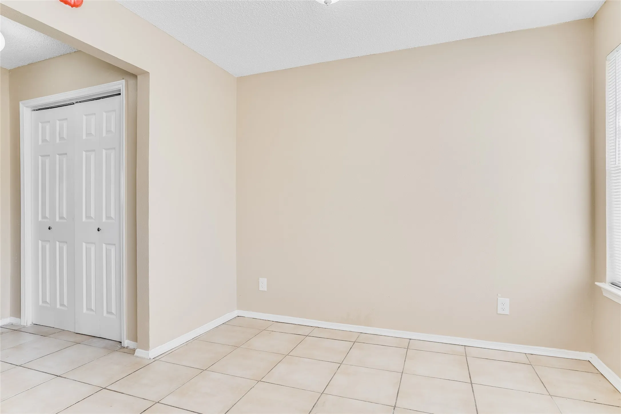 View of tiled spare room