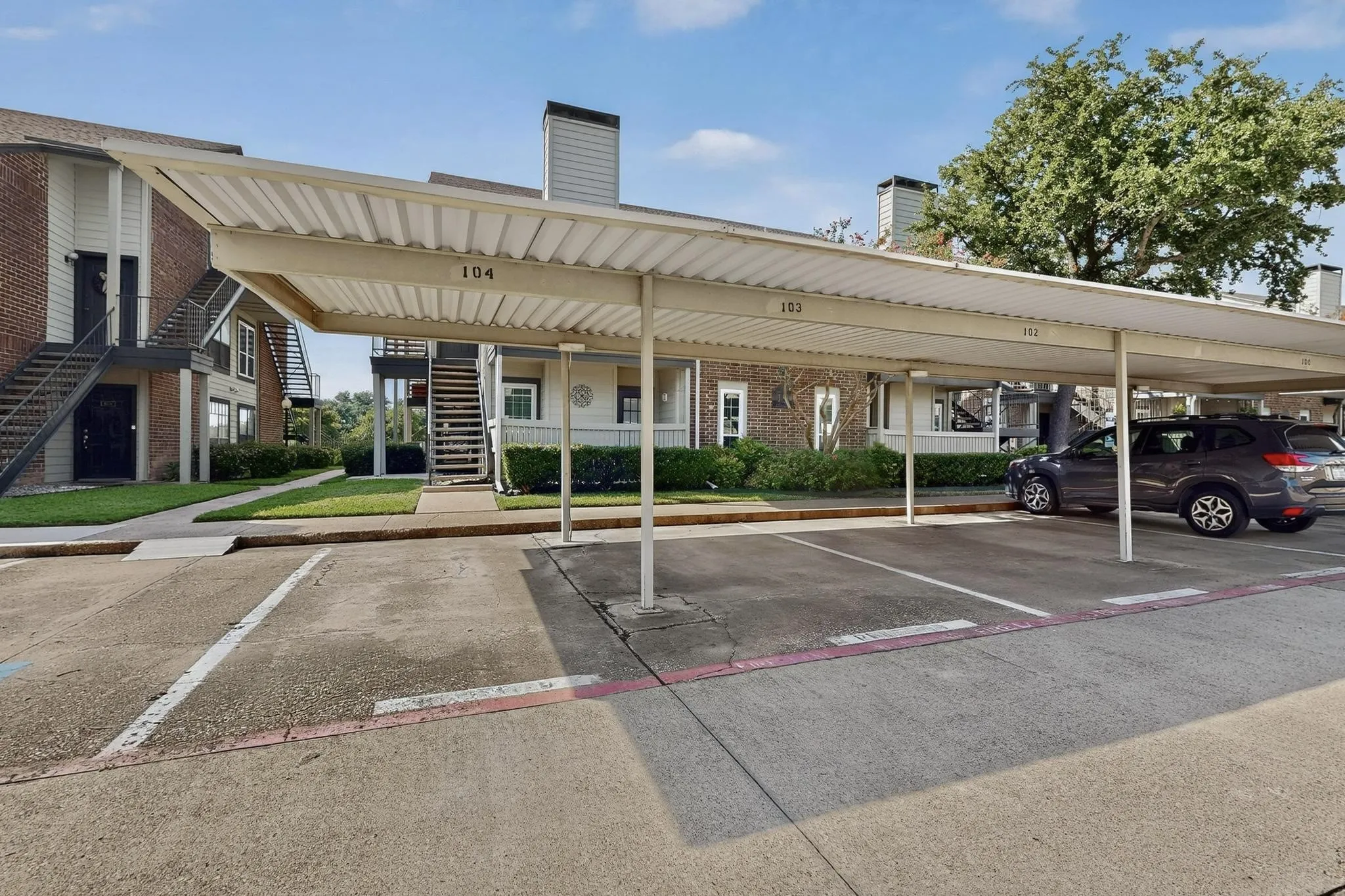 Covered carport parking with designated spaces
