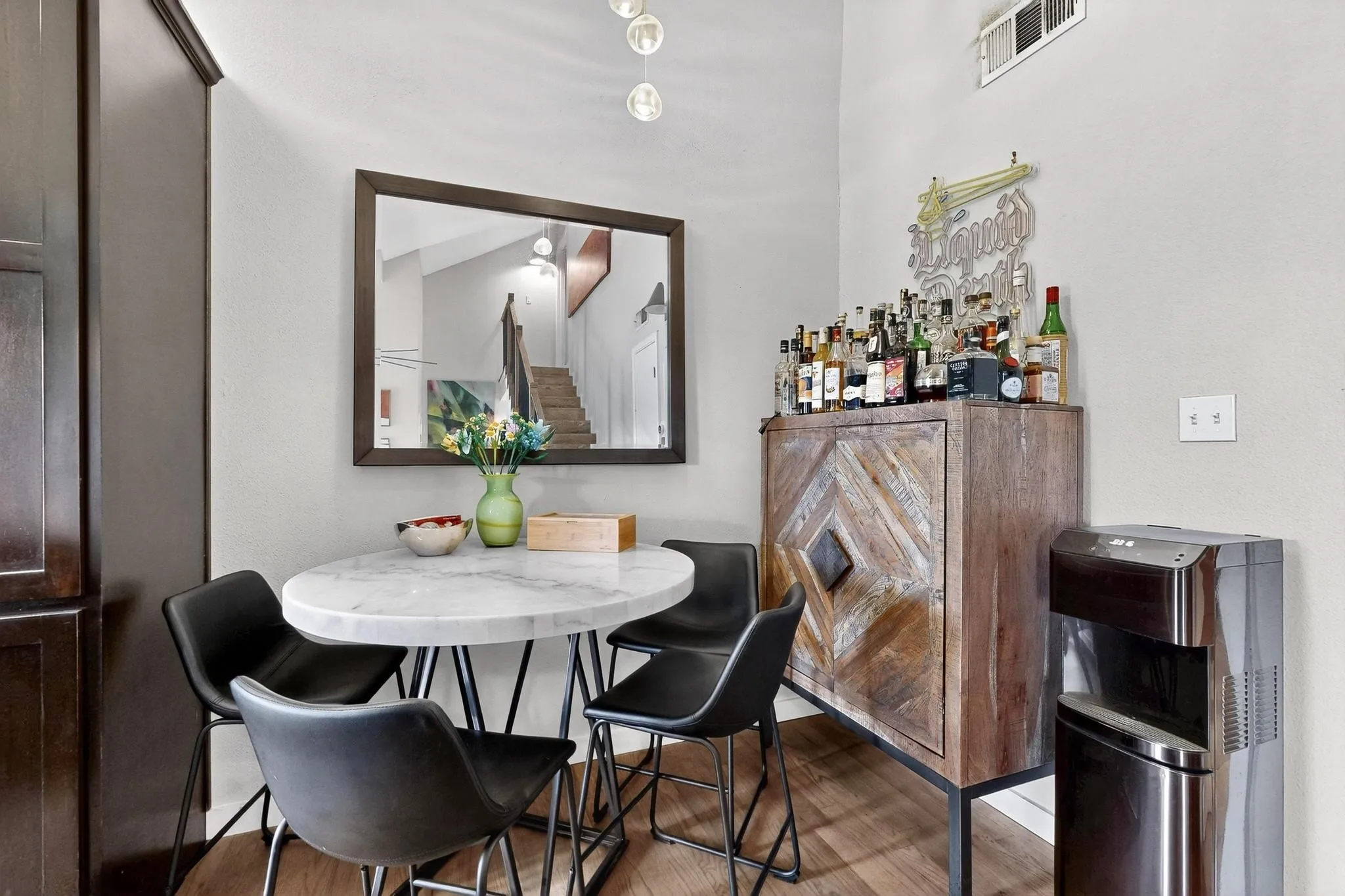 Light-filled interior featuring wood-finish flooring and a neutral color palette