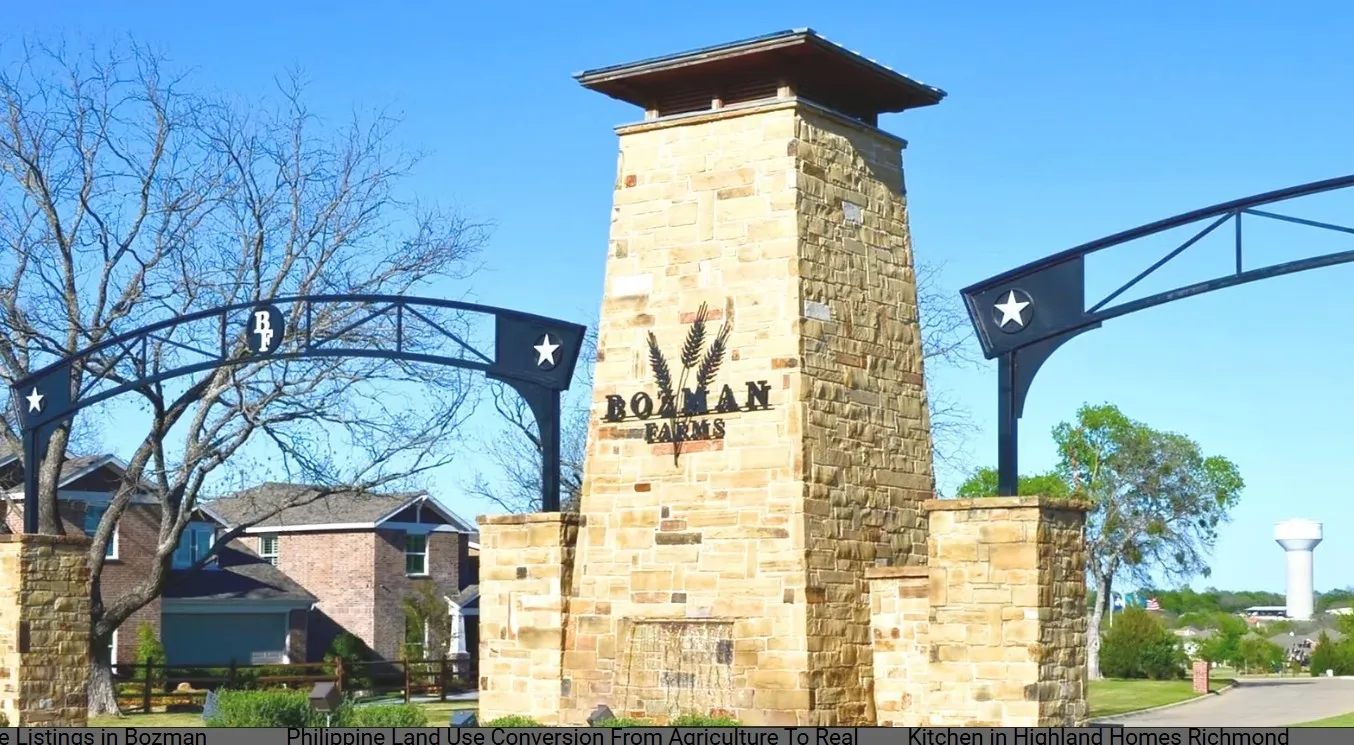 Stone entry monument featuring "Bozman Farms" inscription