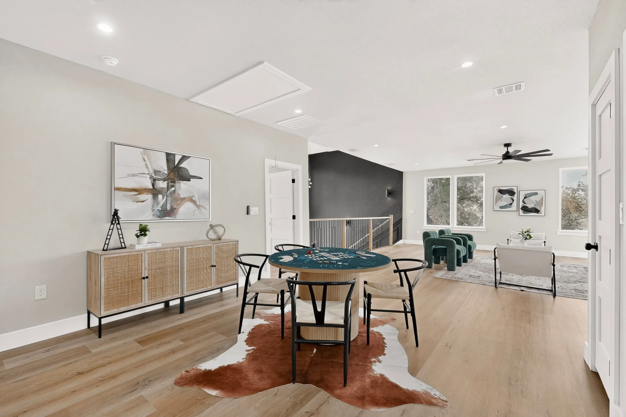 Light wood-finish flooring extending through an open-concept space