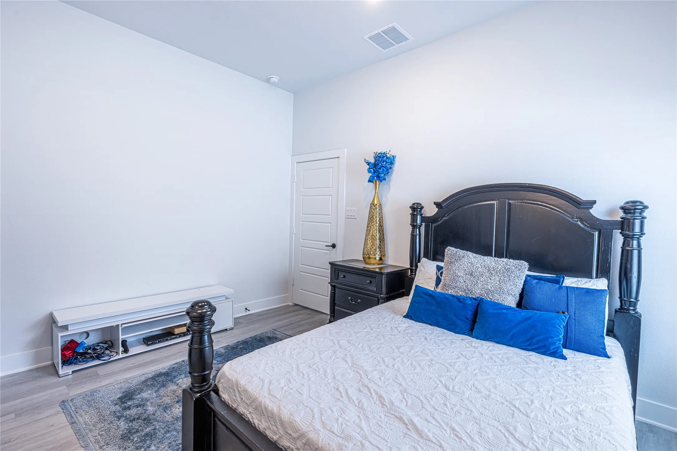 Light-toned walls complement wood-finish flooring