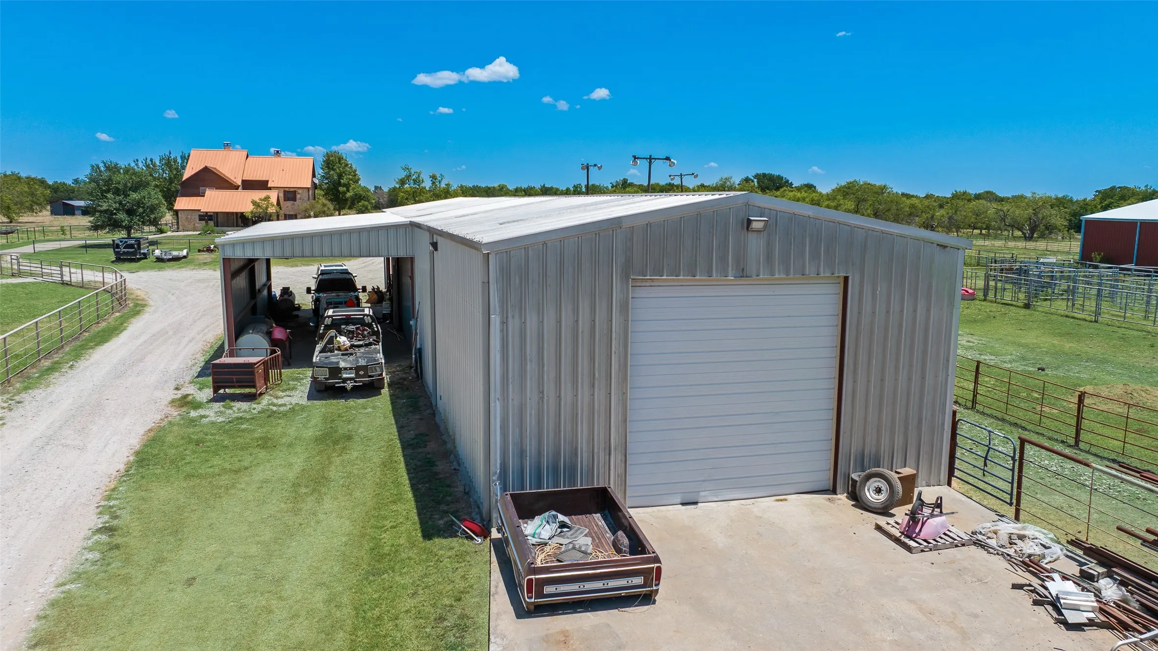 100 X 30 Shop with overhangs on both sides for equipment storage / cover