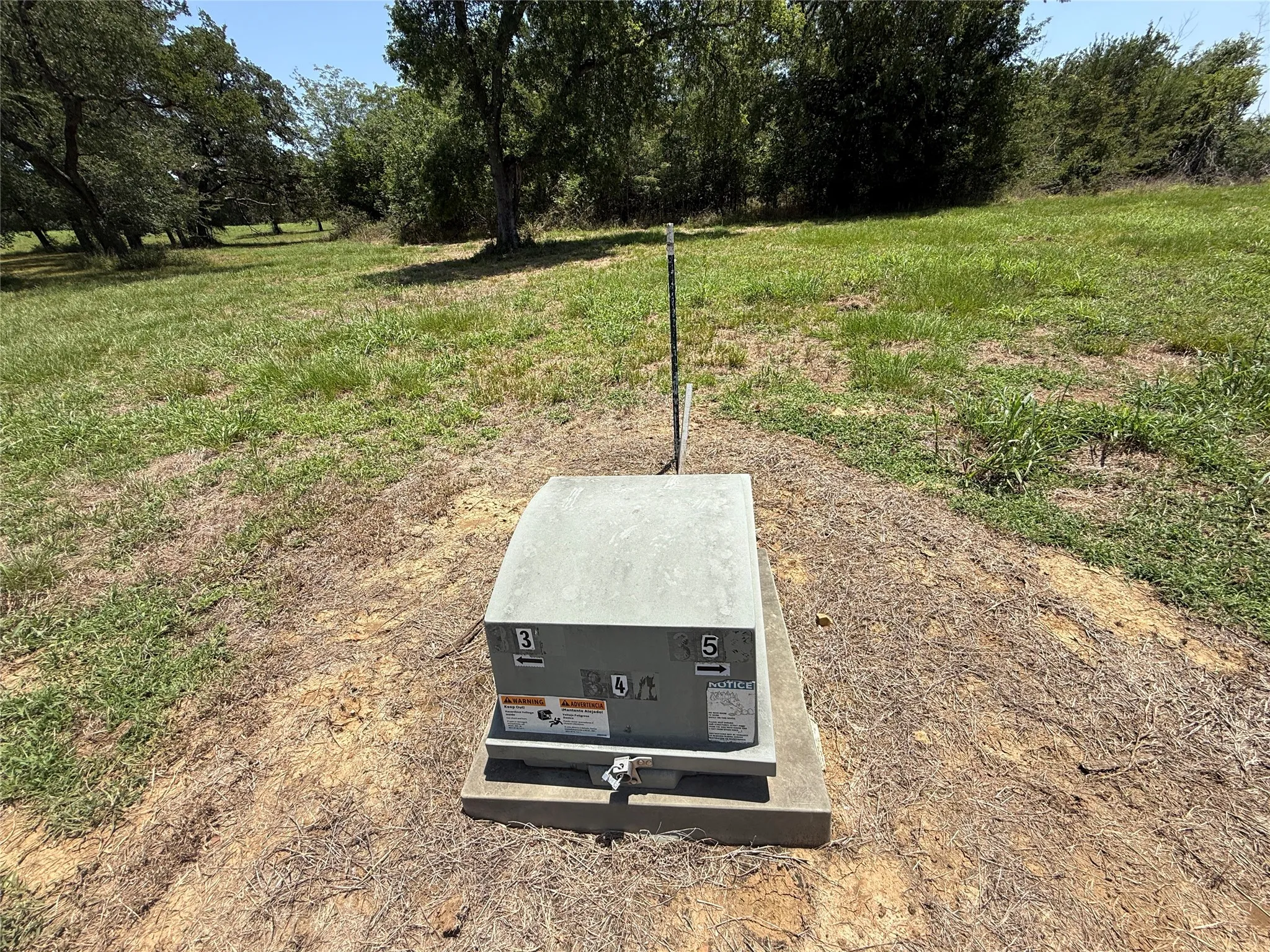 Gentle level topography with underground utilities installed and ready for development.