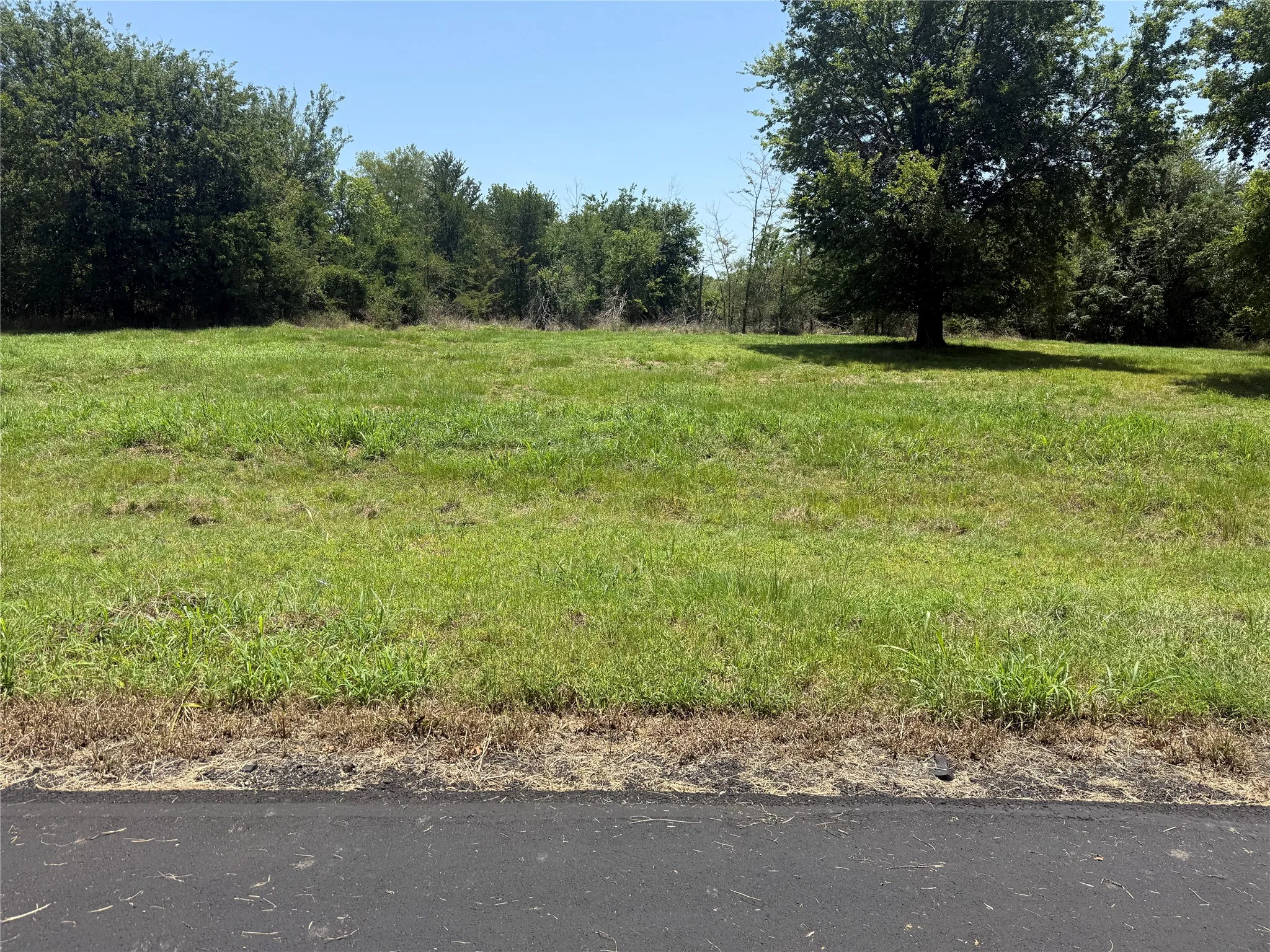 Quiet, paved private street winding through the exclusive gated subdivision of Admiral Shores.