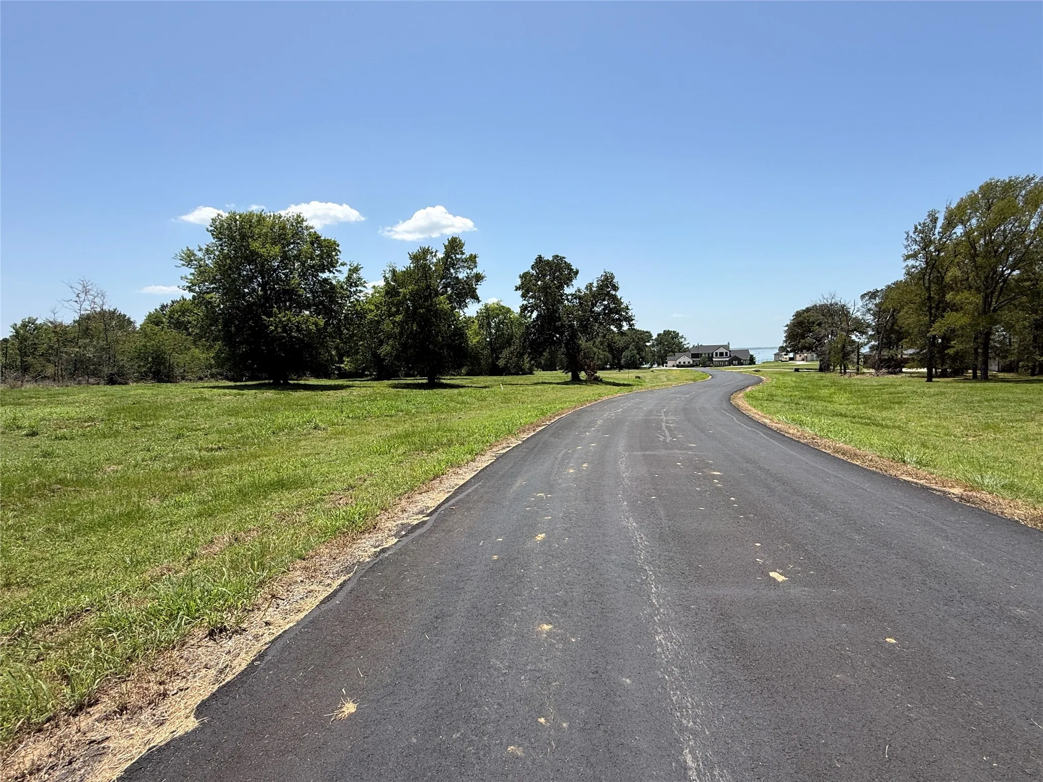 Generous 132-foot road frontage offering flexible driveway and home layout possibilities.