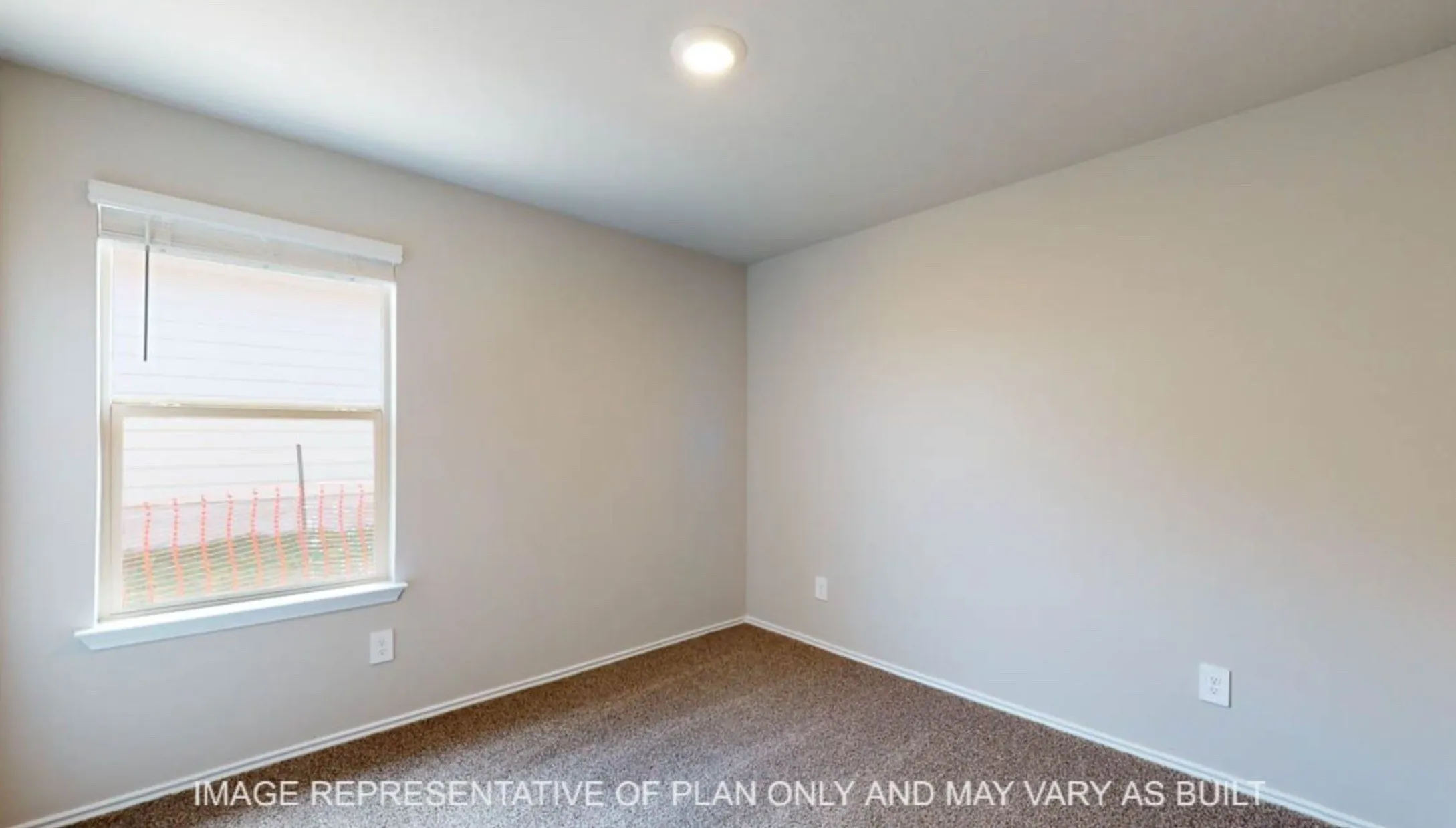 Neutral paint palette with recessed lighting and a single window with blinds