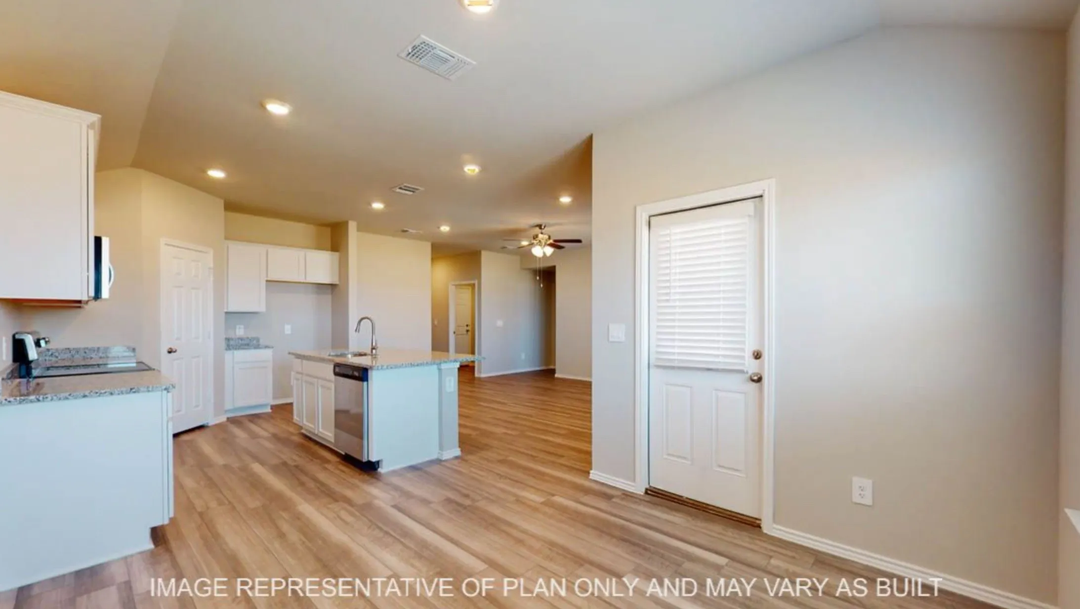Kitchen featuring an island with sink, white cabinetry, speckled countertops, and wood-finish flooring