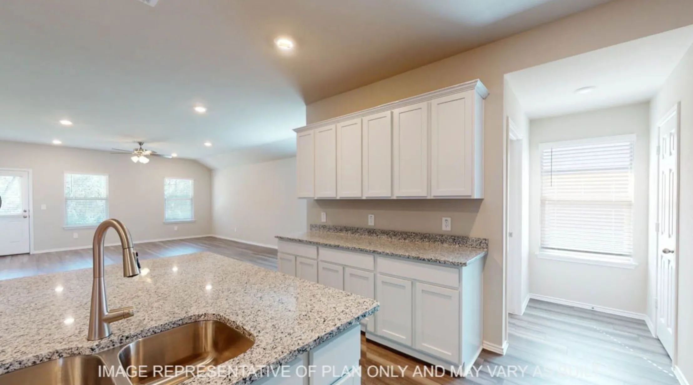 Kitchen island with granite countertop and stainless steel sink