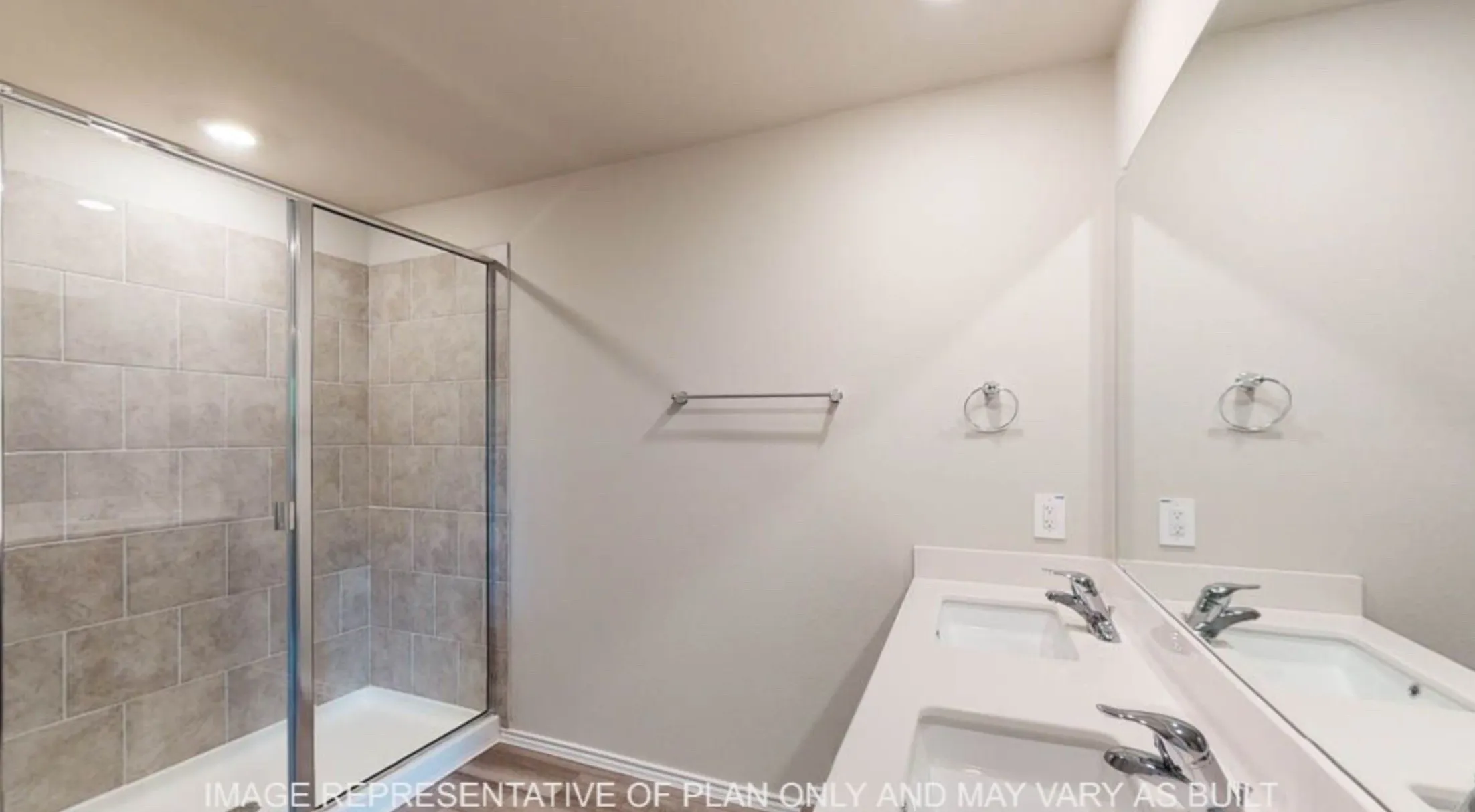 Shower with glass enclosure and neutral-toned rectangular tile surround