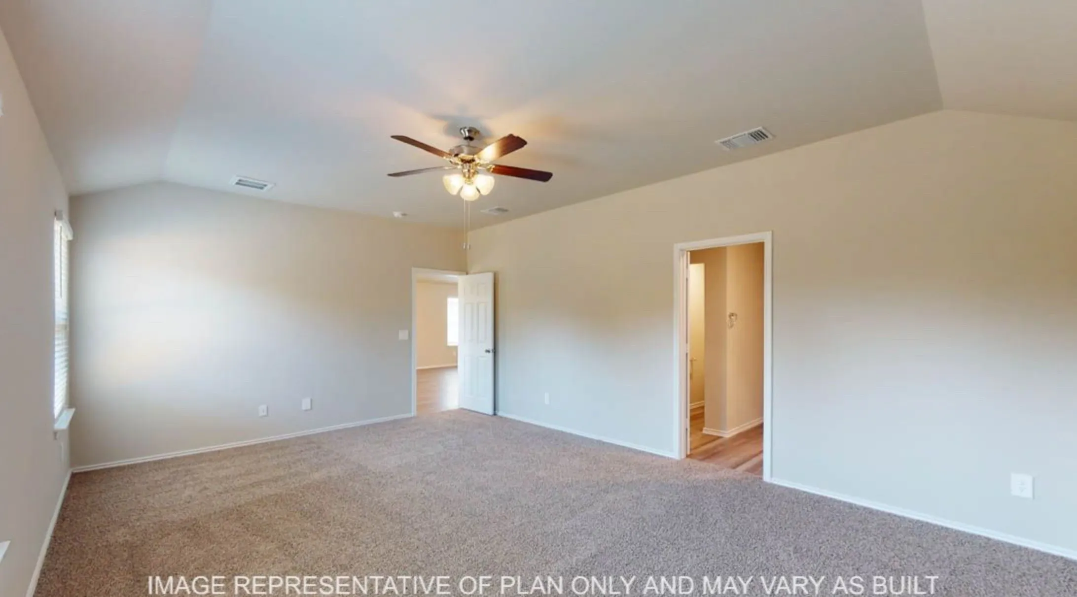 Spacious room featuring vaulted ceilings, neutral-toned carpeting, a ceiling fan with light fixture, and window with blinds