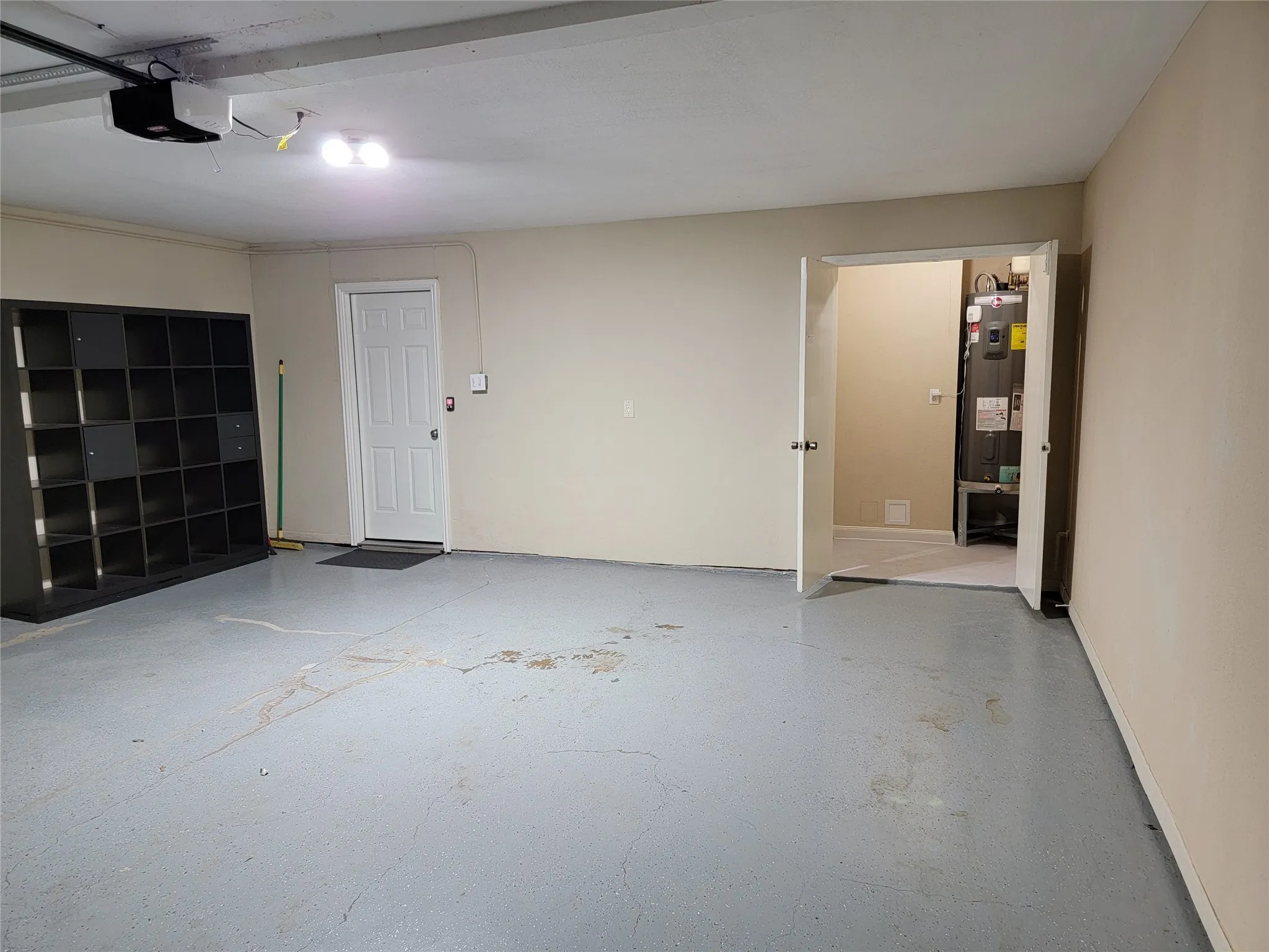 Large attached 2 car garage with extra storage