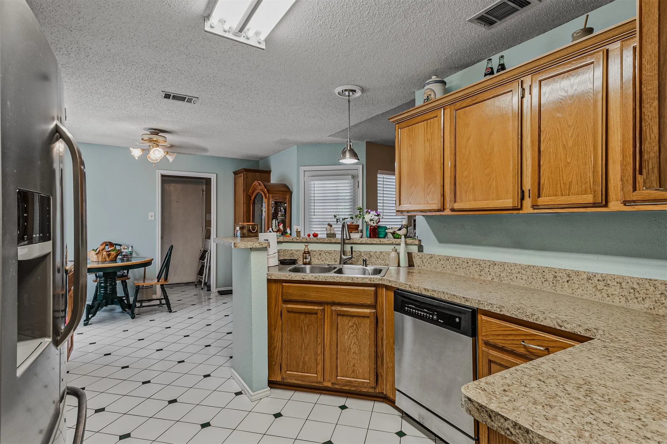 Ample cabinetry in kitchen with brreakfast bar